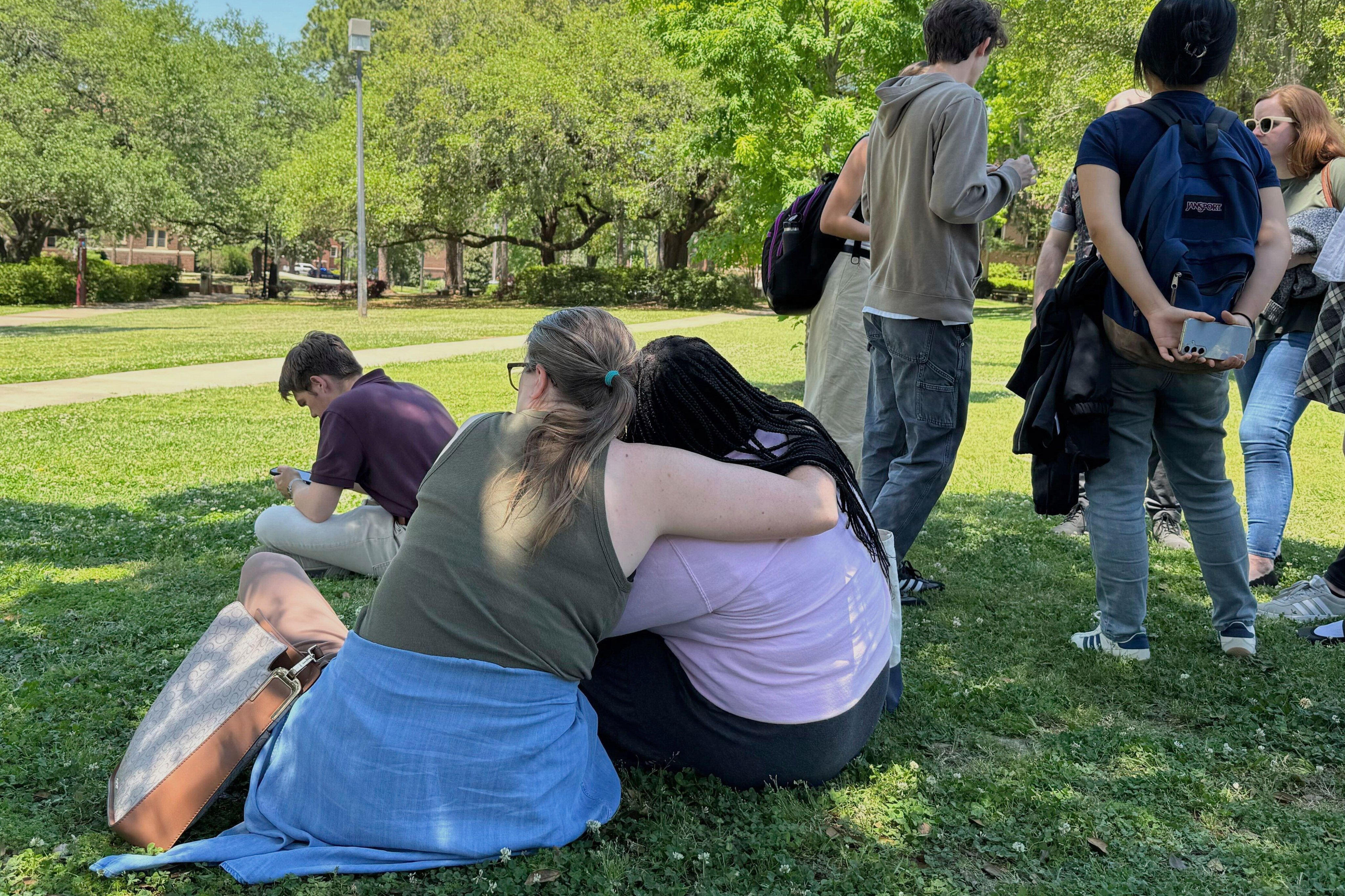 People comfort each other after a shooting at Florida State University’s campus in Tallahassee in 2025. Photo: AP