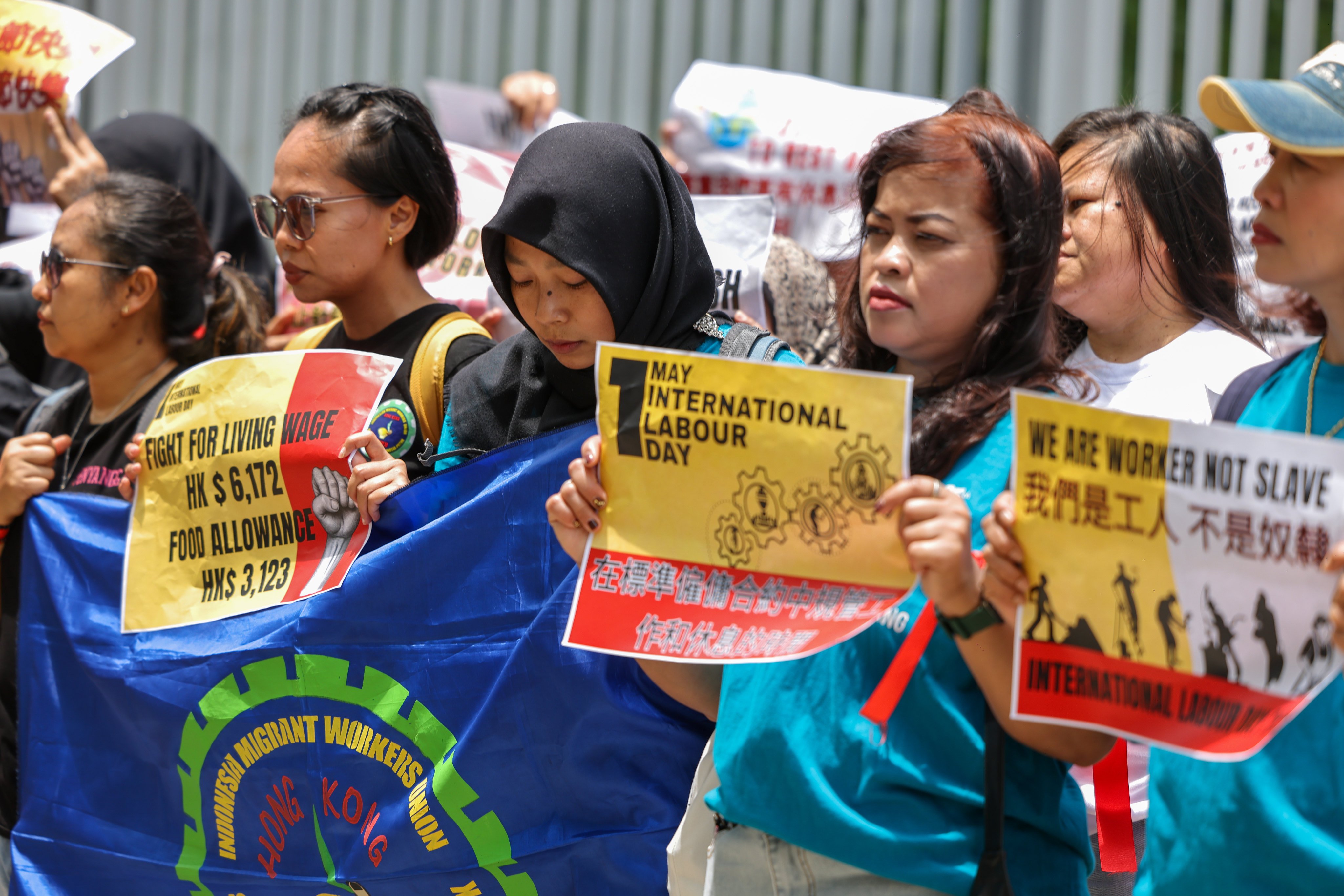 The Asian Migrants Coordinating Body holds a protest to call for a living wage and better working conditions for migrant domestic workers in Hong Kong, in front of the Central Government Offices, on May 1. Photo: Nora Tam