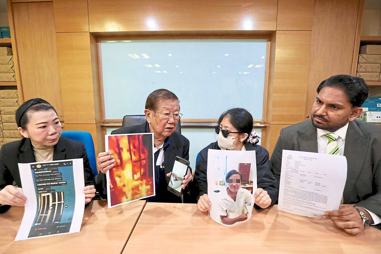 Lim (second from right) shows a picture of the tenant during a press conference in Kuala Lumpur on Monday. Photo: The Star