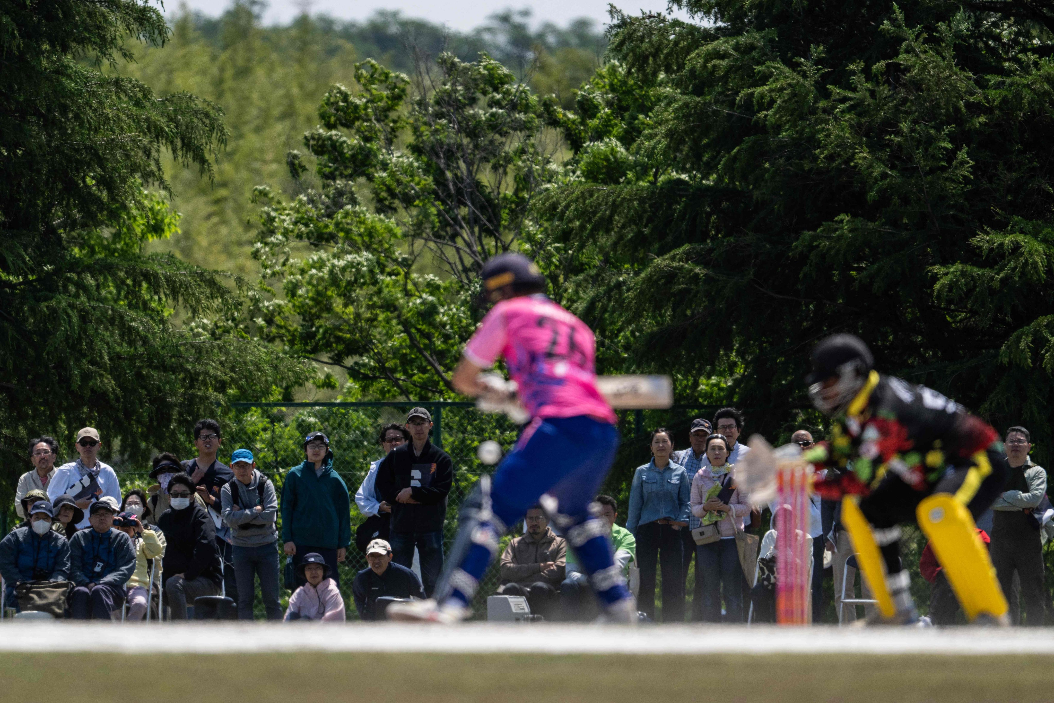 About 300 people turned up to watch Japan’s opening game against Vanuatu in the ICC T20 World Cup East Asia-Pacific Qualifiers at the Nisshin Cricket Ground at Korogi Sports Park on Saturday. Photo: AFP