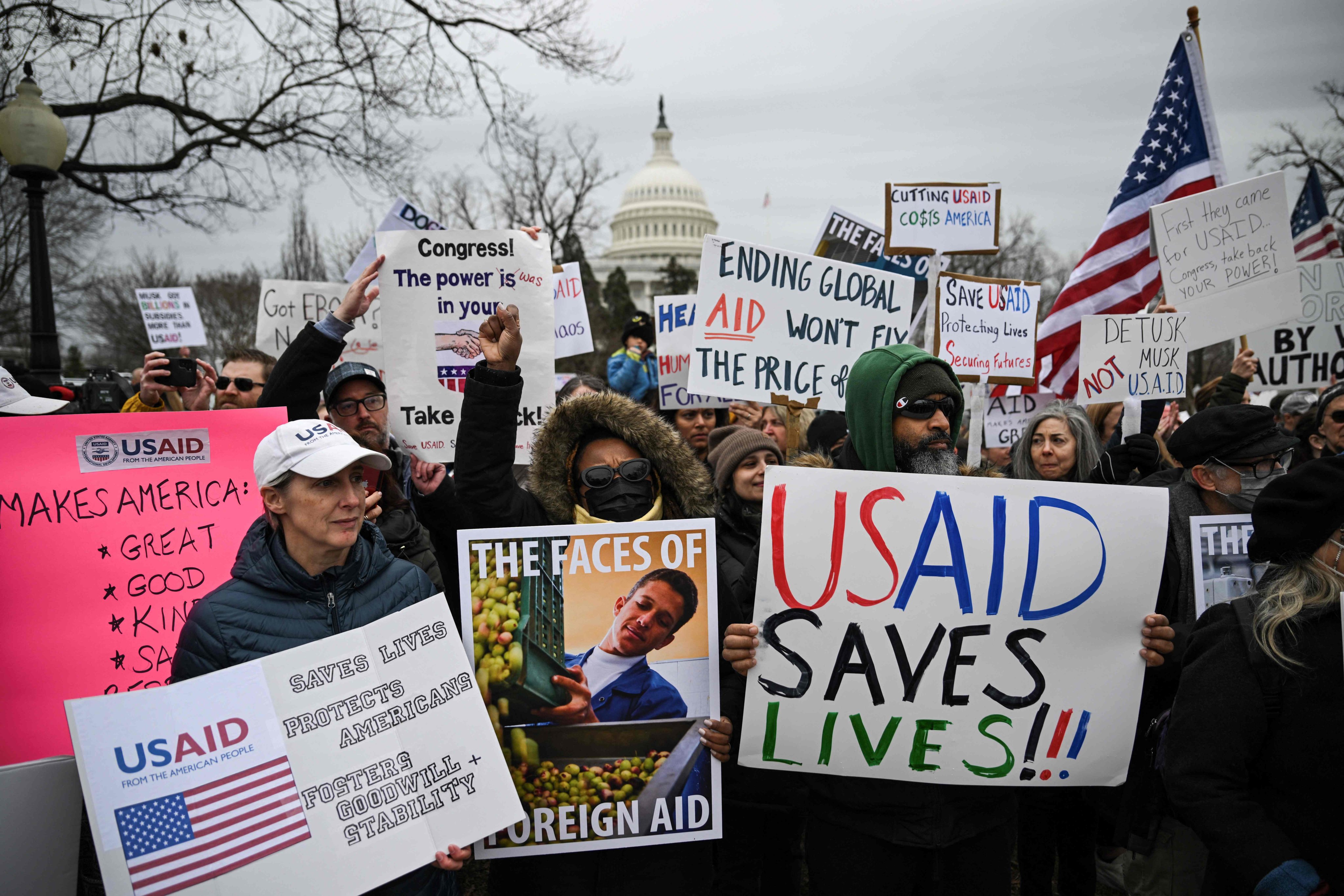 People protest in Washington in February last year against the administration of US President Donald Trump’s decision to virtually shut down the US Agency for International Development (USAID). Photo: AFP