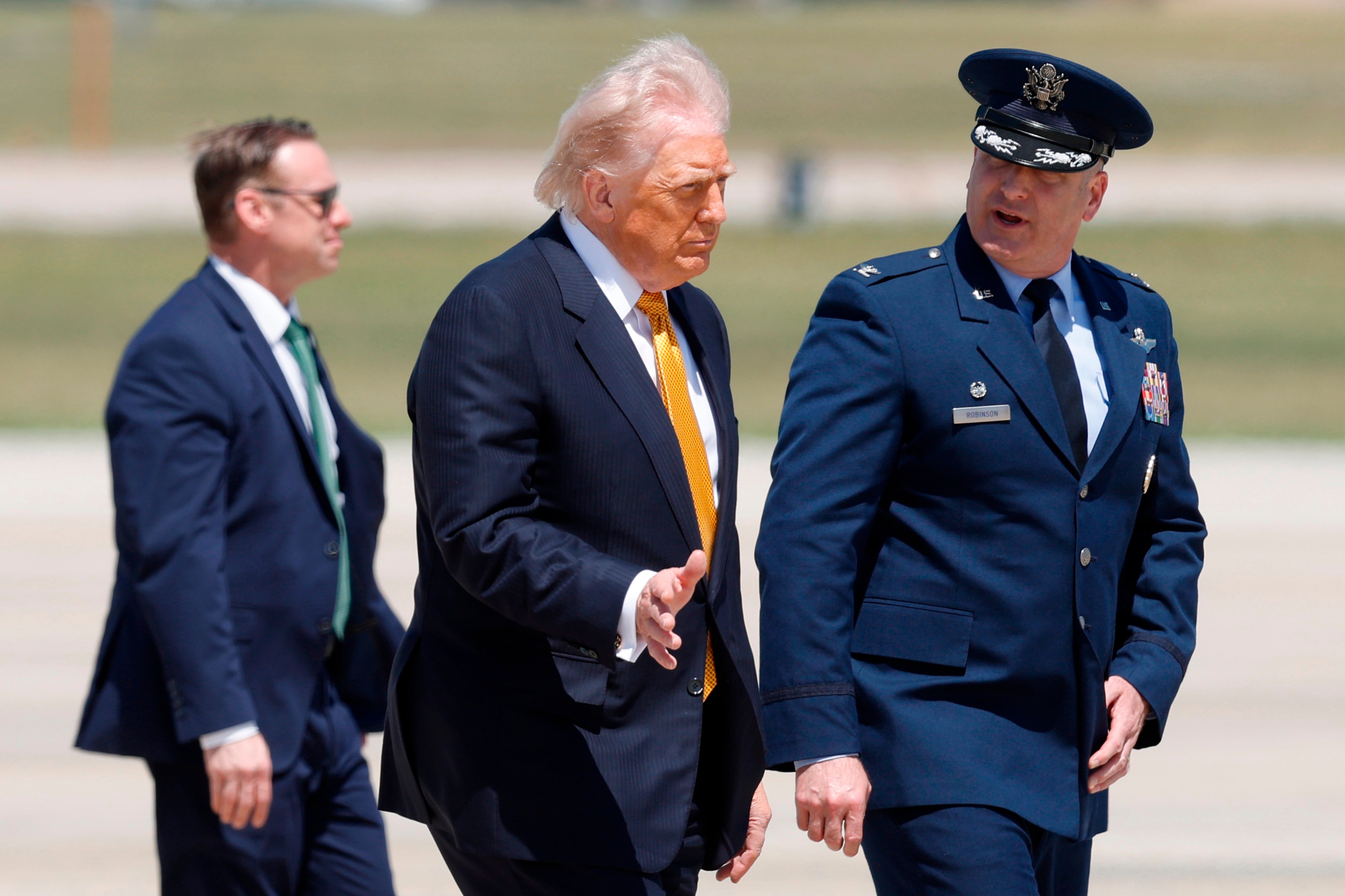 Donald Trump (centre) walks to Air Force One at Joint Base Andrews in Maryland on Tuesday en route to his meeting with Chinese President Xi Jinping. Photo: AP