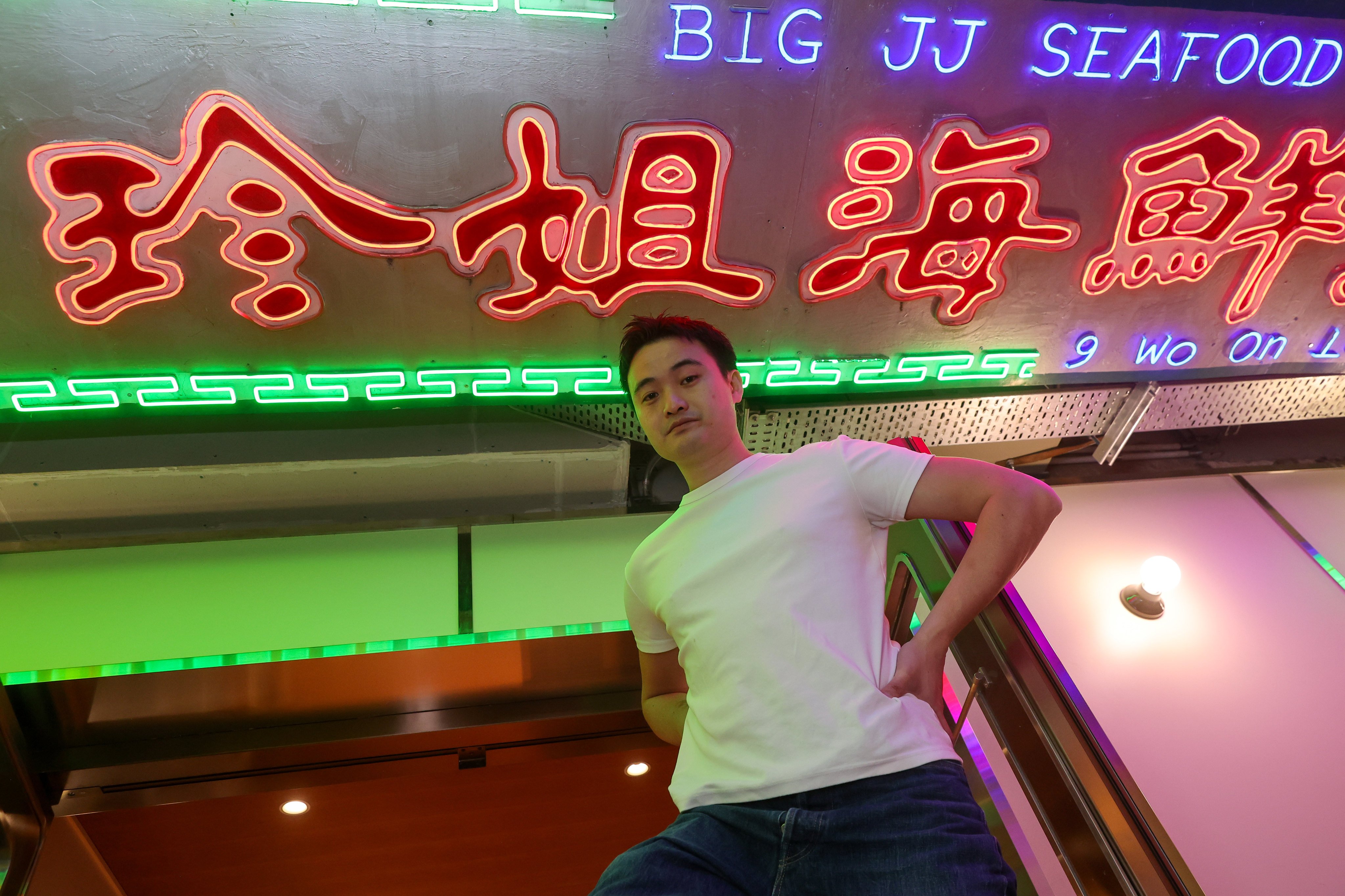 Peter Pang at Big JJ Seafood Hotpot at its new location at Landmark Prince’s in Central, Hong Kong. The original venue’s neon sign (pictured) now lives on the ceiling of the new location. Photo: Edmond So