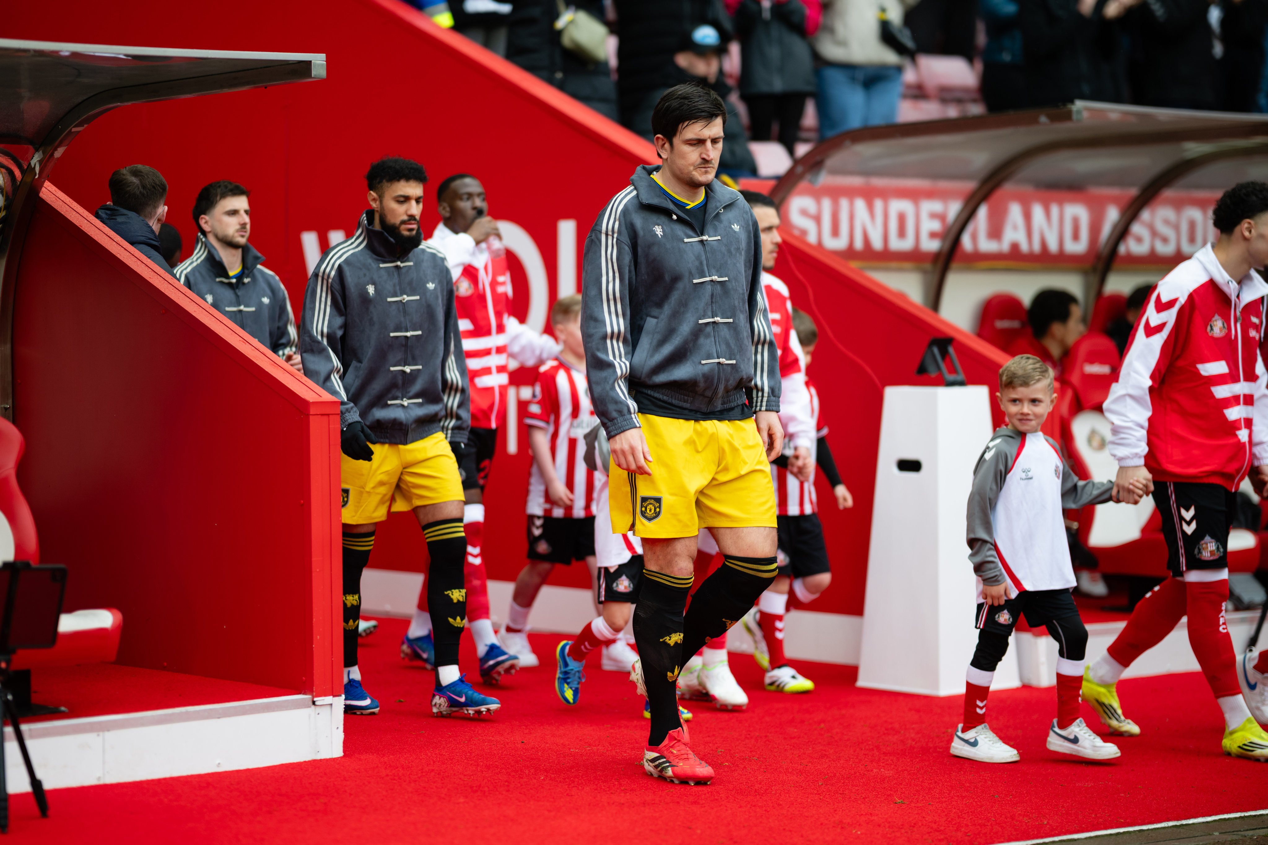Harry Maguire (right) walks out ahead of his Manchester United teammates in their new tracksuit tops before the Premier League match away to Sunderland on Saturday. Photo: Getty Images