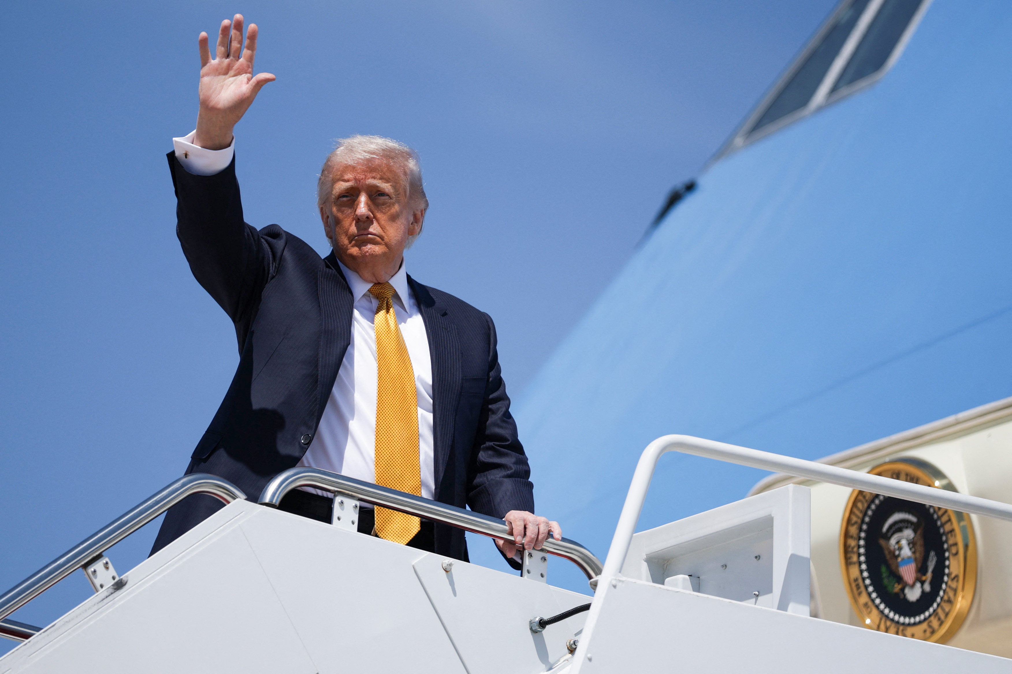 US President Donald Trump boards Air Force One for his trip to China. Photo: AFP