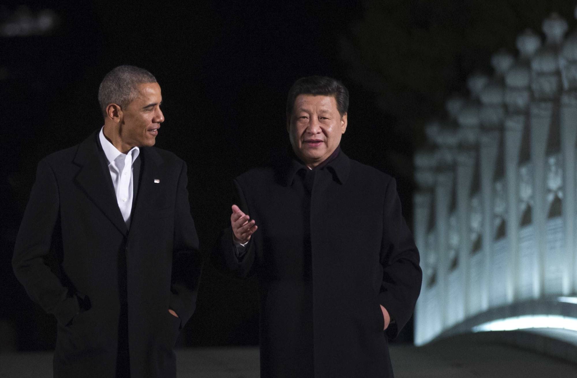 Former US president Barack Obama walks with Chinese President Xi Jinping at the Zhongnanhai leaders’ compound, in Beijing in November 2014. Photo: AFP