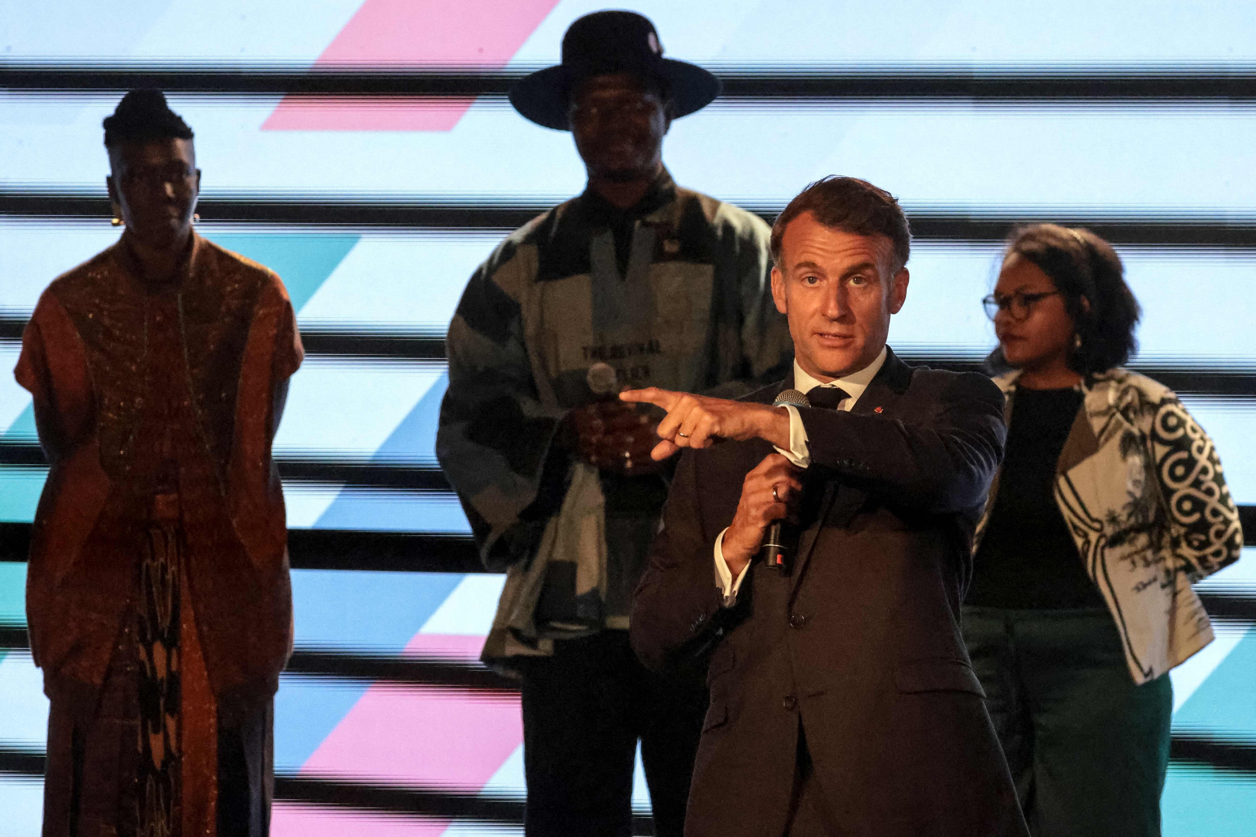 France’s President Emmanuel Macron criticising attendees for talking over the speakers. Photo: AFP