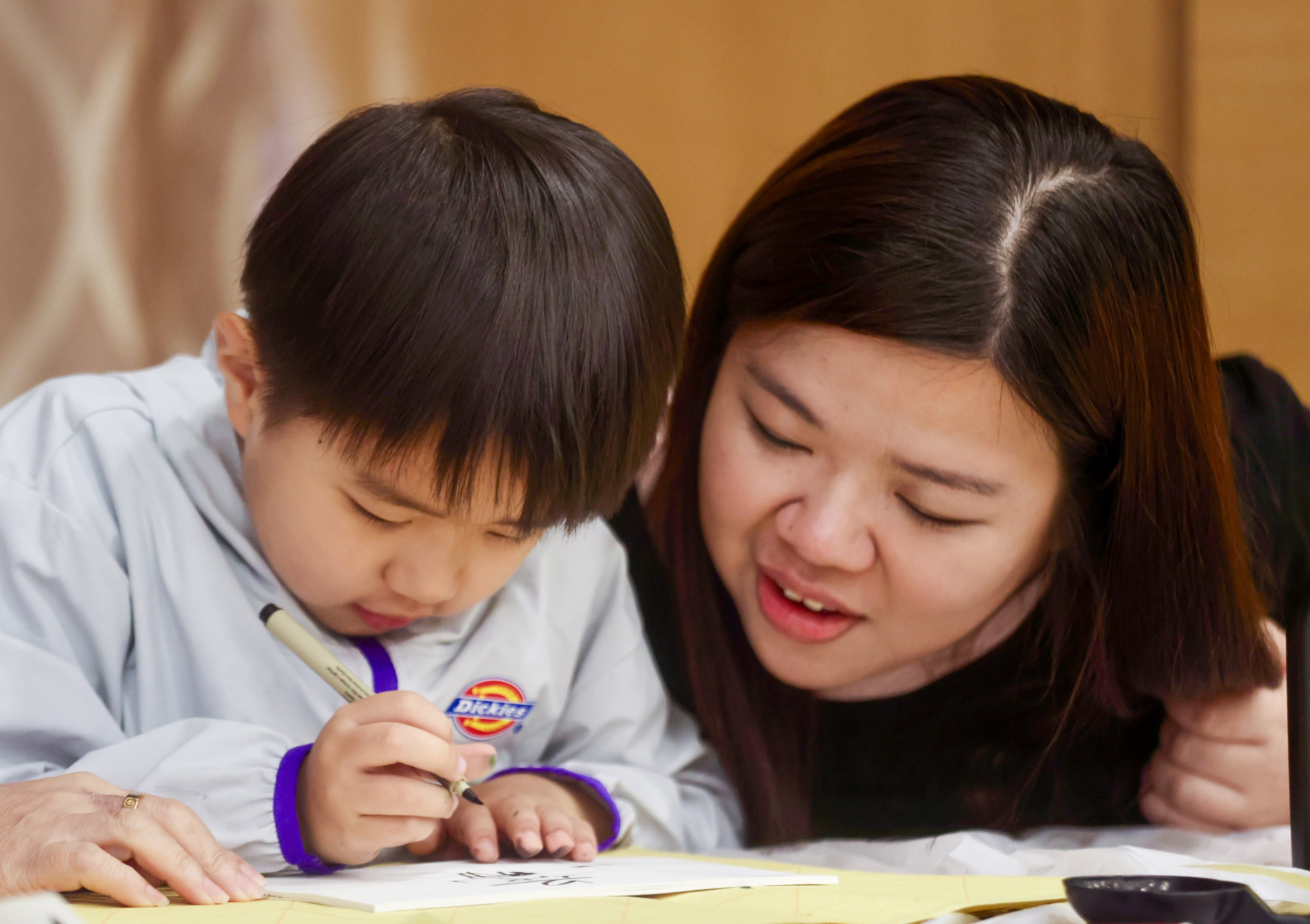 Chau Ting-ting and her son, Ziyi, are among those who have benefited from the programme. Photo: Jonathan Wong