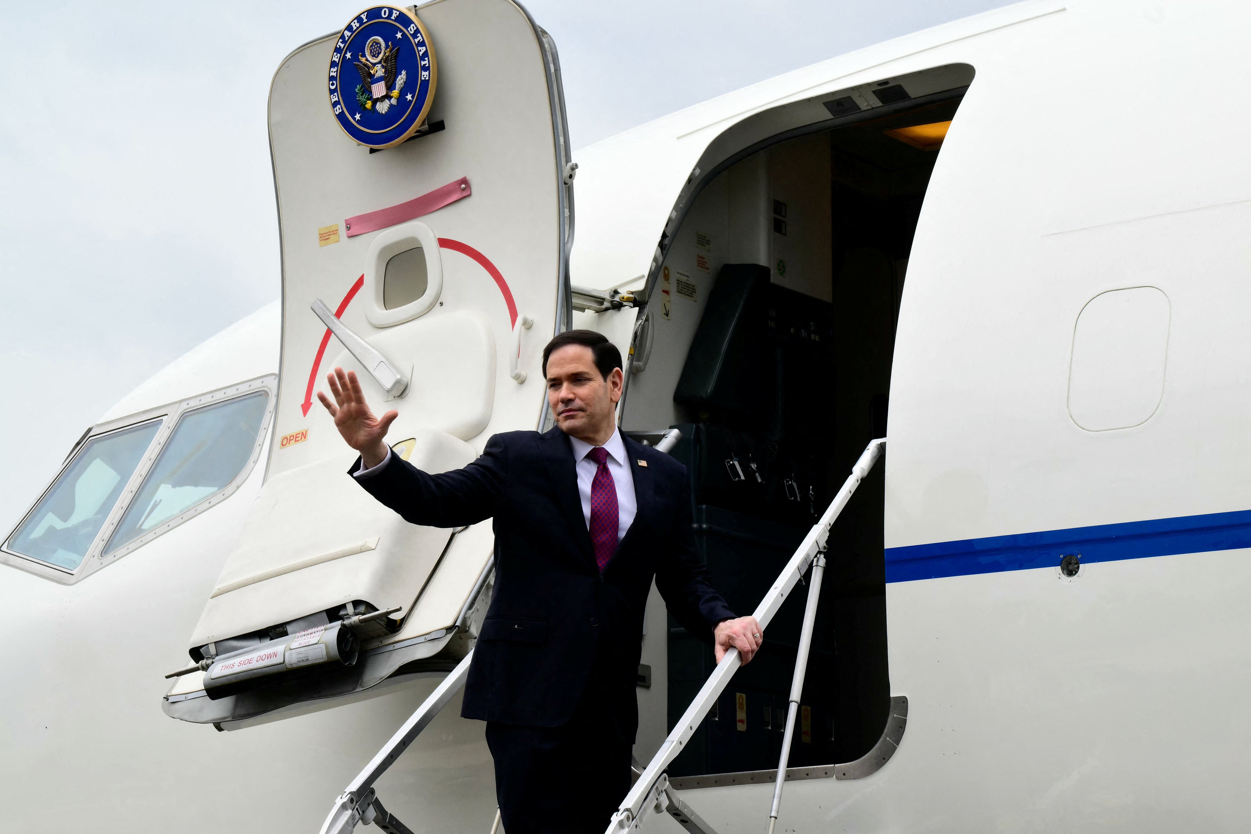 U.S. Secretary of State Marco Rubio waves as he boards his plane at the end of a visit to Italy and the Vatican, at Rome's Ciampino airport, Italy on May 8, 2026.    STEFANO RELLANDINI/Pool via REUTERS