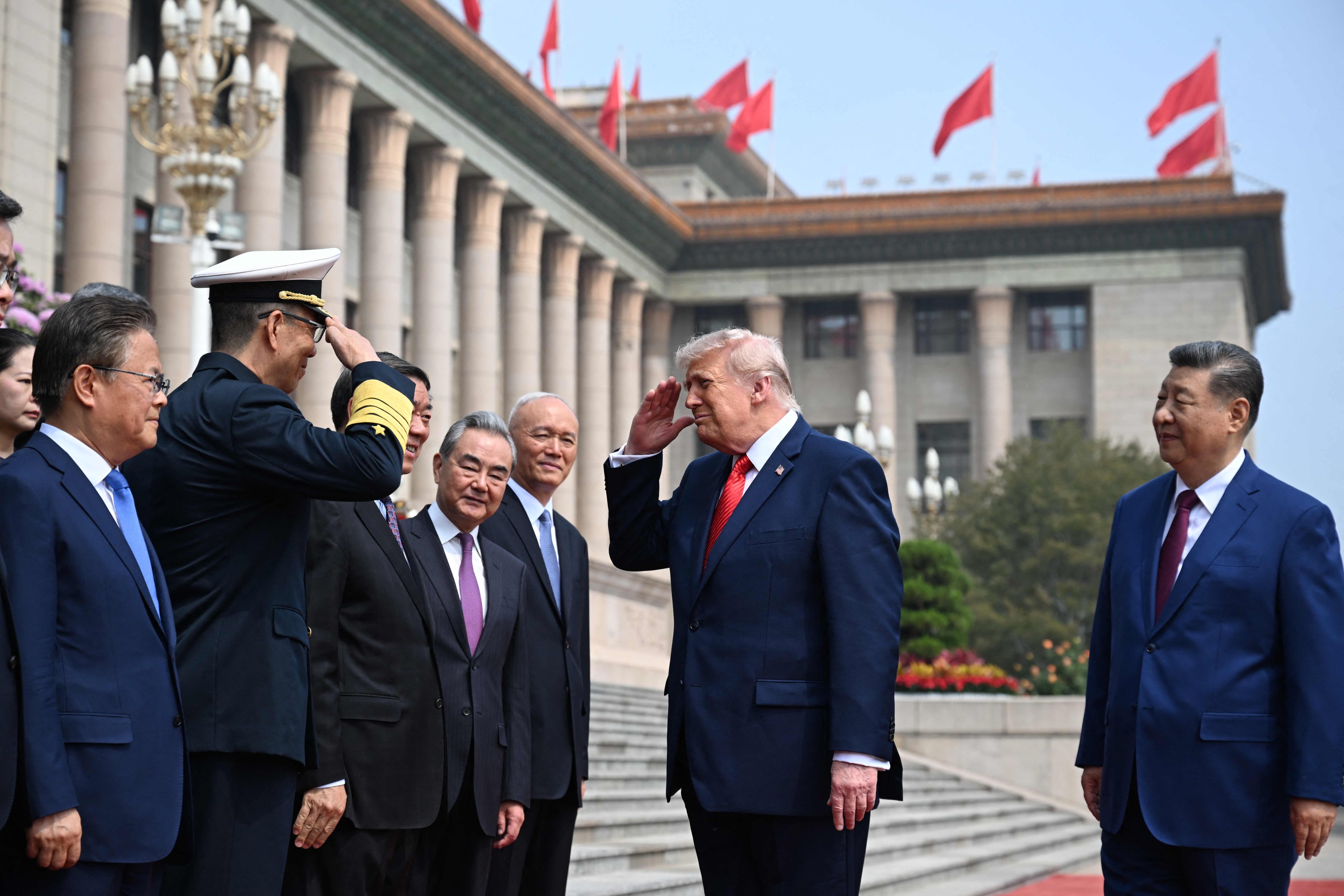 US President Donald Trump  salutes China’s Defence Minister Dong Jun (second left) as President Xi Jinping and top Chinese officials look on, at the Great Hall of the People in Beijing on Thursday. Photo: AFP