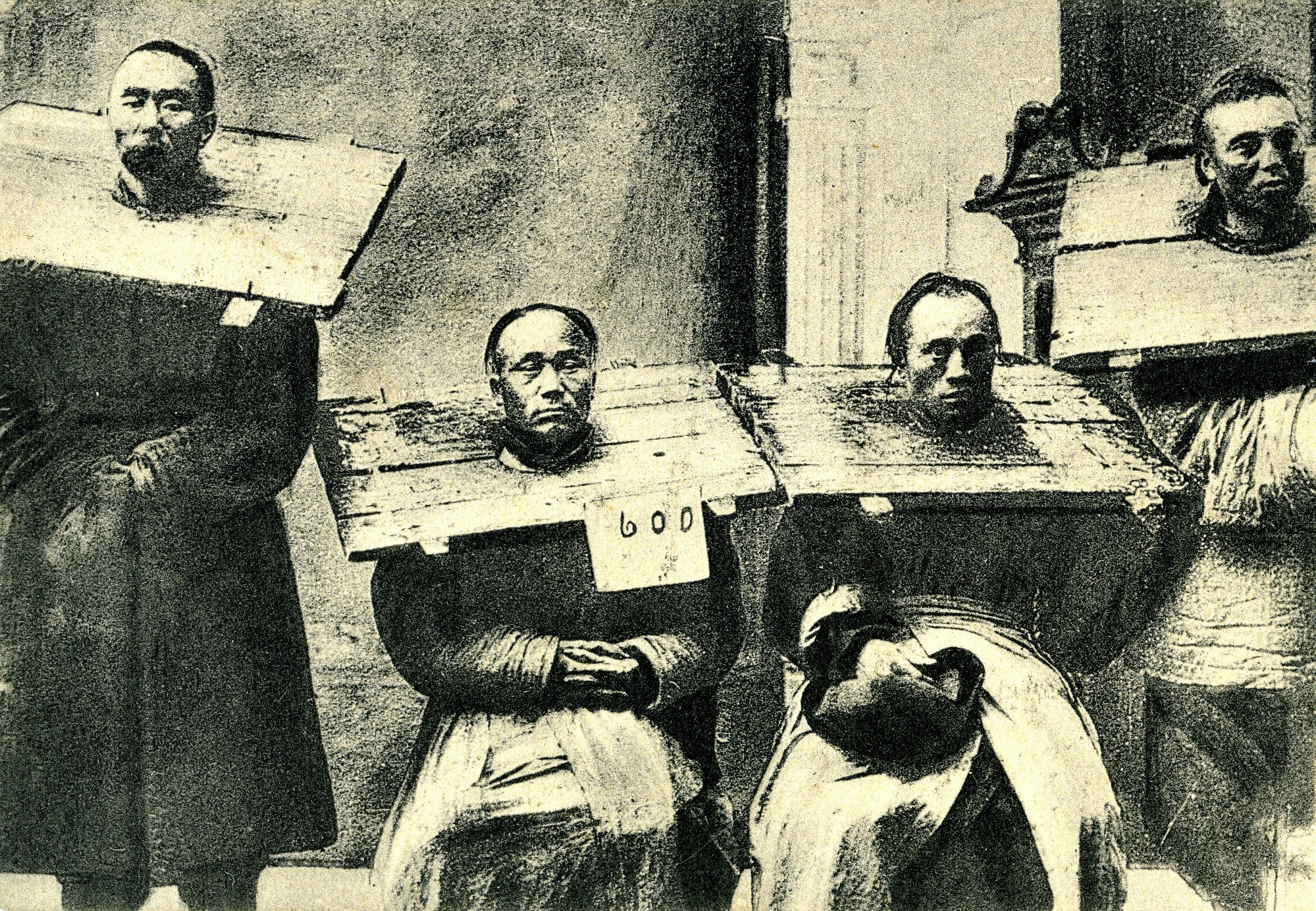 This image shows prisoners in ancient times wearing a device used for corporal punishment and humiliation. Photo: Getty Images