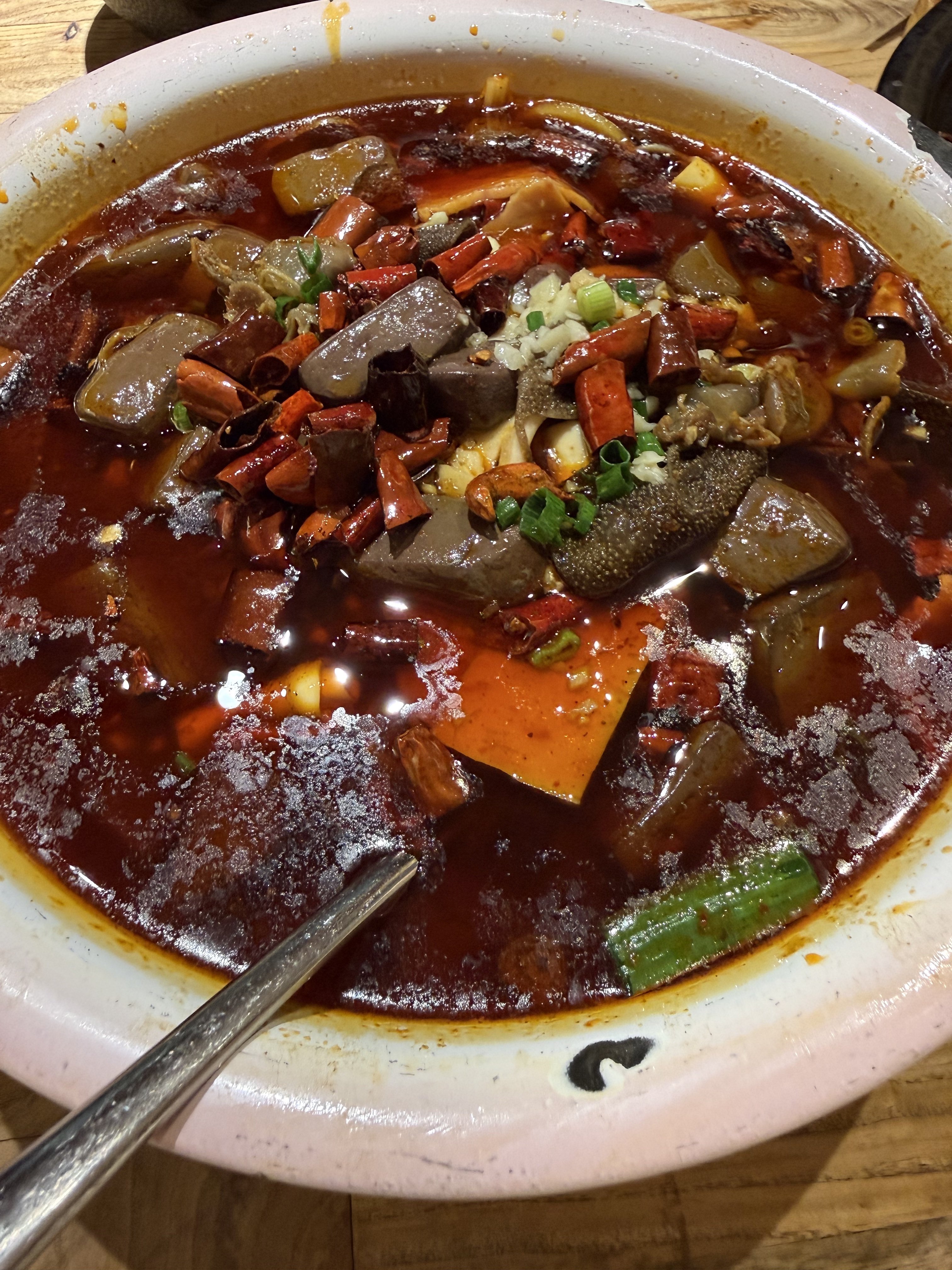 Taolin restaurant’s signature mao xue wang – silken duck blood curd and snappy tripe submerged in an oil-slicked broth dense with chillies and peppercorns. Photo: Pin Yen Tan