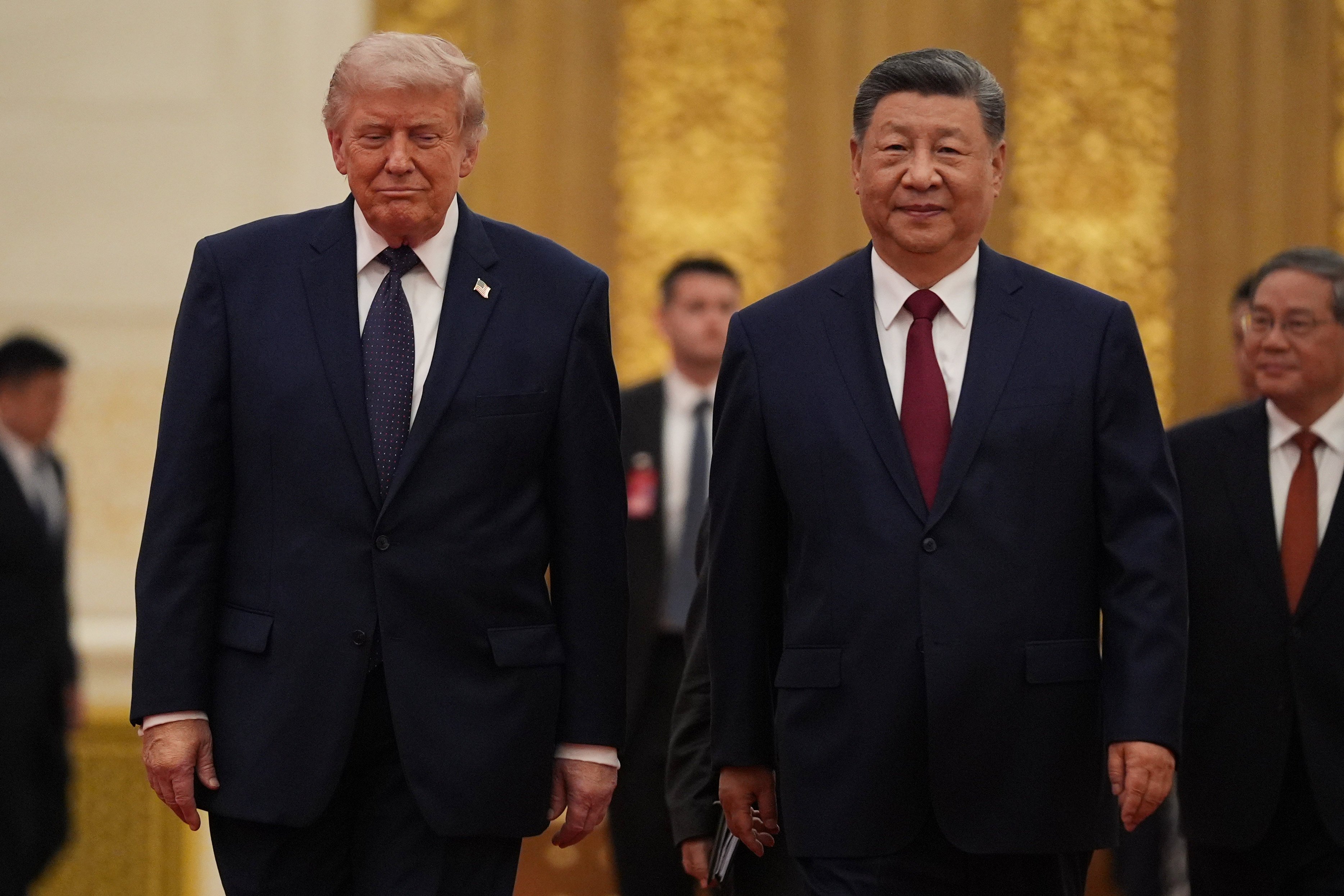 US President Donald Trump and Chinese President Xi Jinping arrive for a state dinner at the Great Hall of the People. Photo: AP