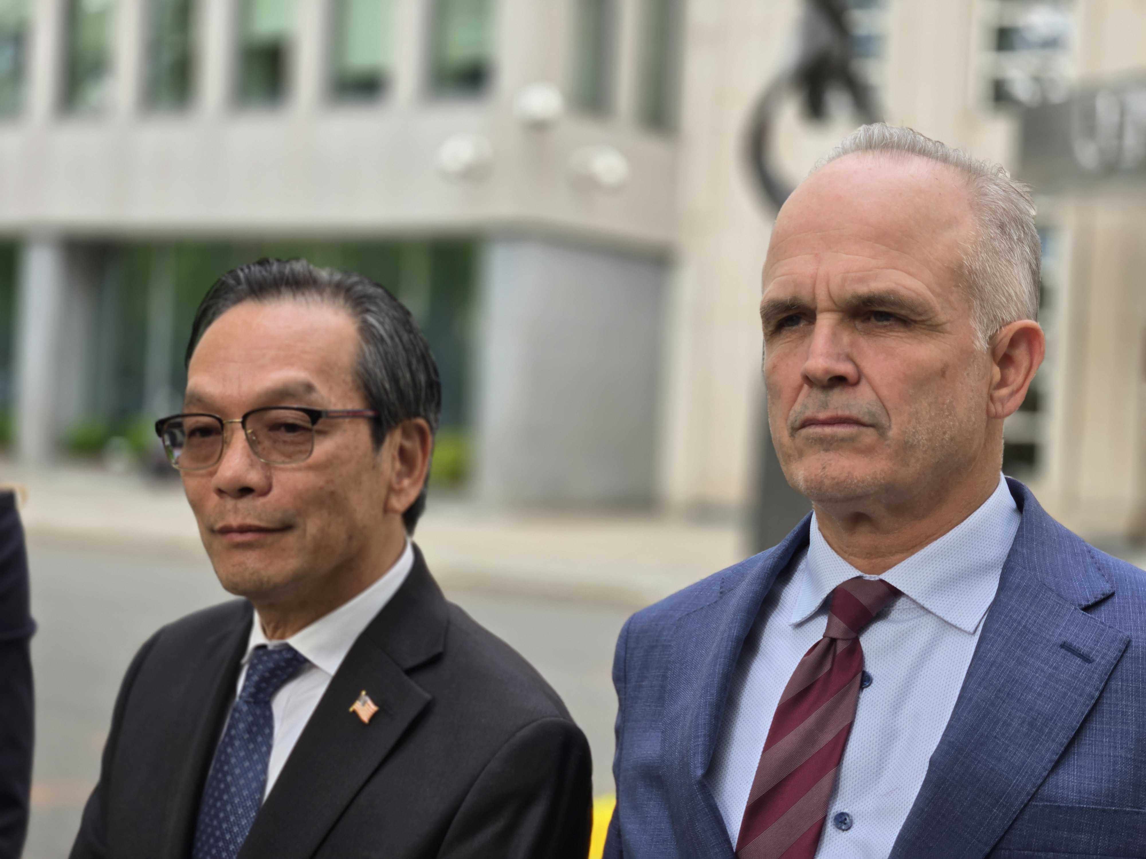 Lu Jianwang (left) and defence lawyer John Carman outside federal court in Brooklyn, New York, on Wednesday moments after the verdict was read. Photo: SCMP