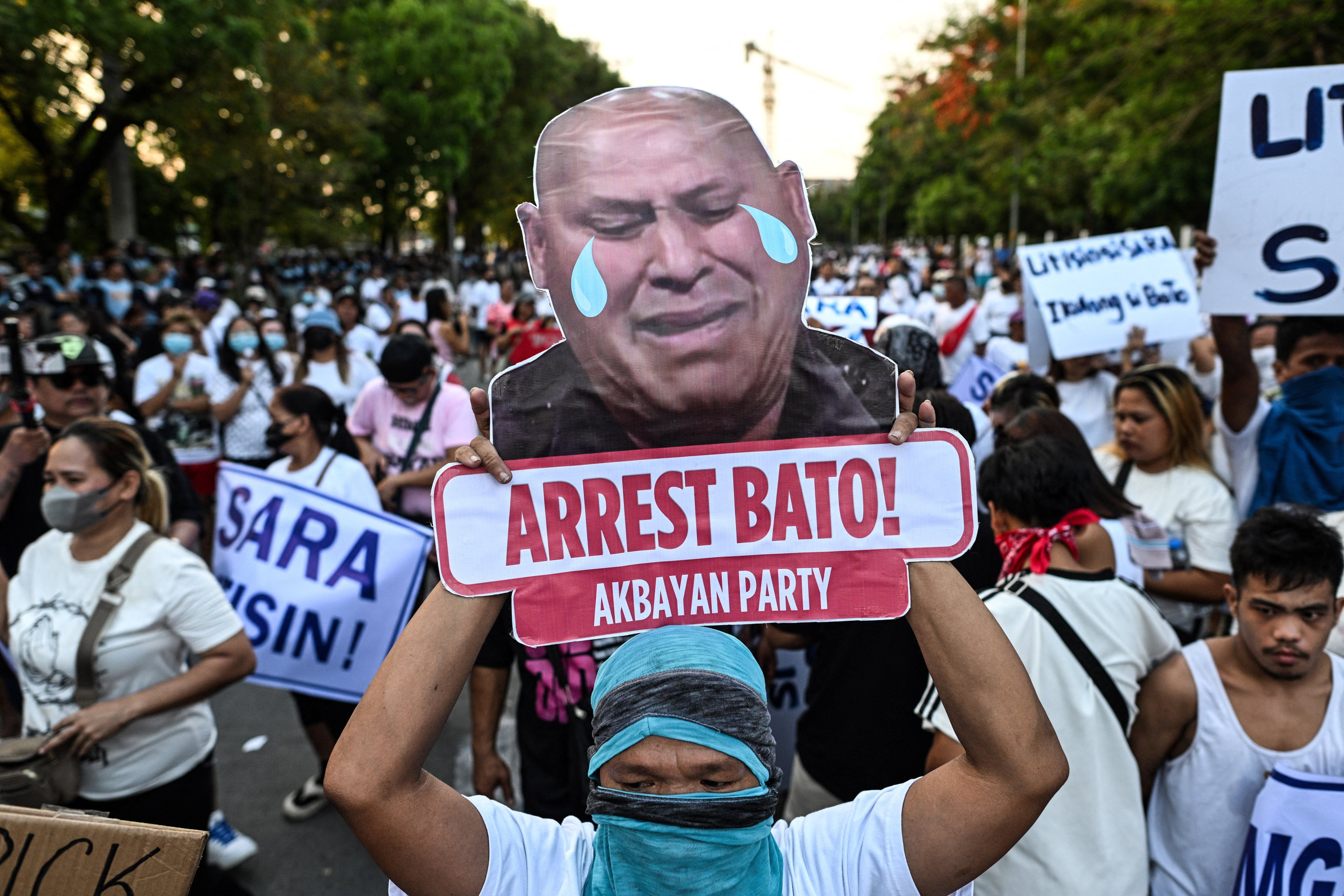 People call for the arrest of Senator Ronald dela Rosa during a protest outside the Philippine Senate on Wednesday. Photo: Reuters