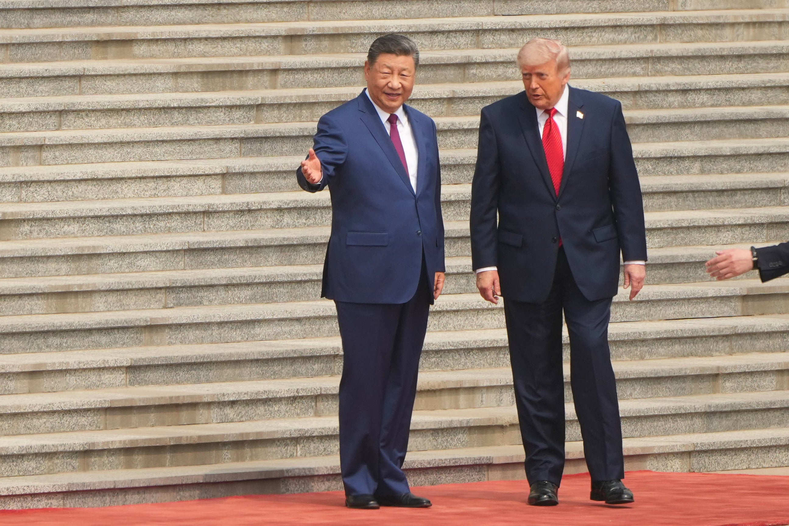 Chinese President Xi Jinping greets US President Donald Trump during the welcome ceremony. Photo: AP