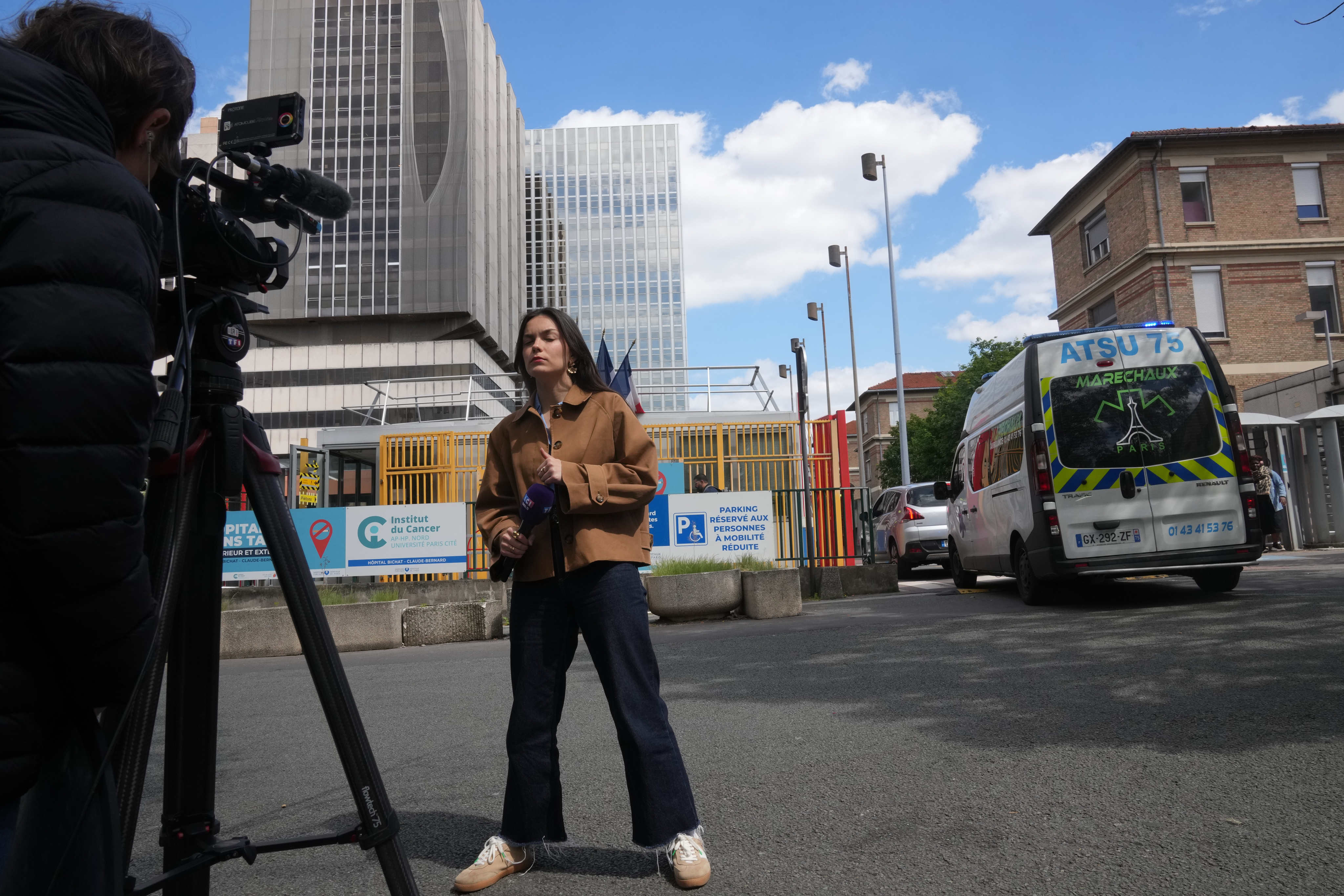 Reporters stand in front of the Bichat Hospital where a woman who tested positive for hantavirus remains in intensive care, in Paris on Tuesday. Photo: AP