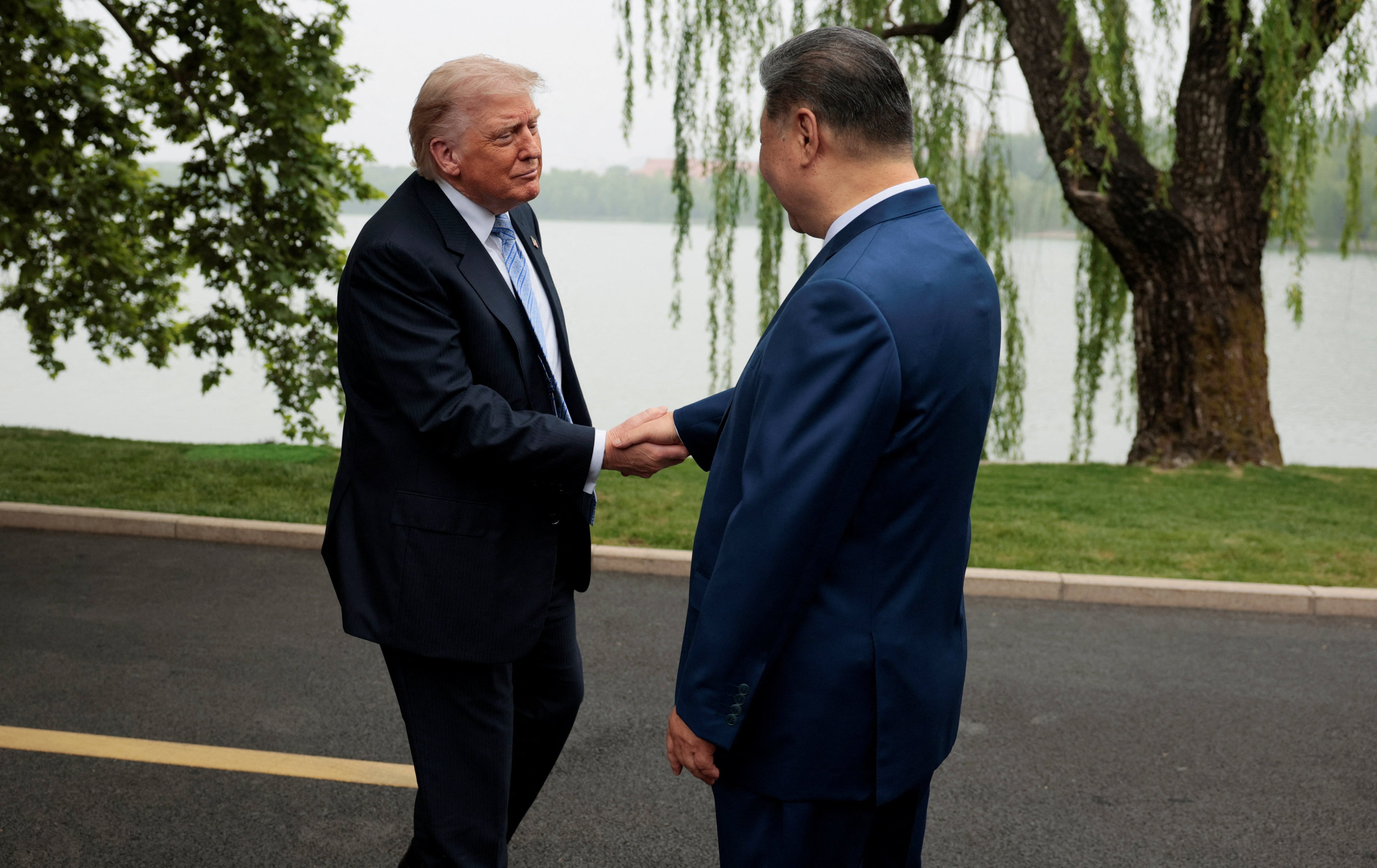 US President Donald Trump and Chinese President Xi Jinping shake hands at Zhongnanhai Garden in Beijing on Friday. Photo: Reuters