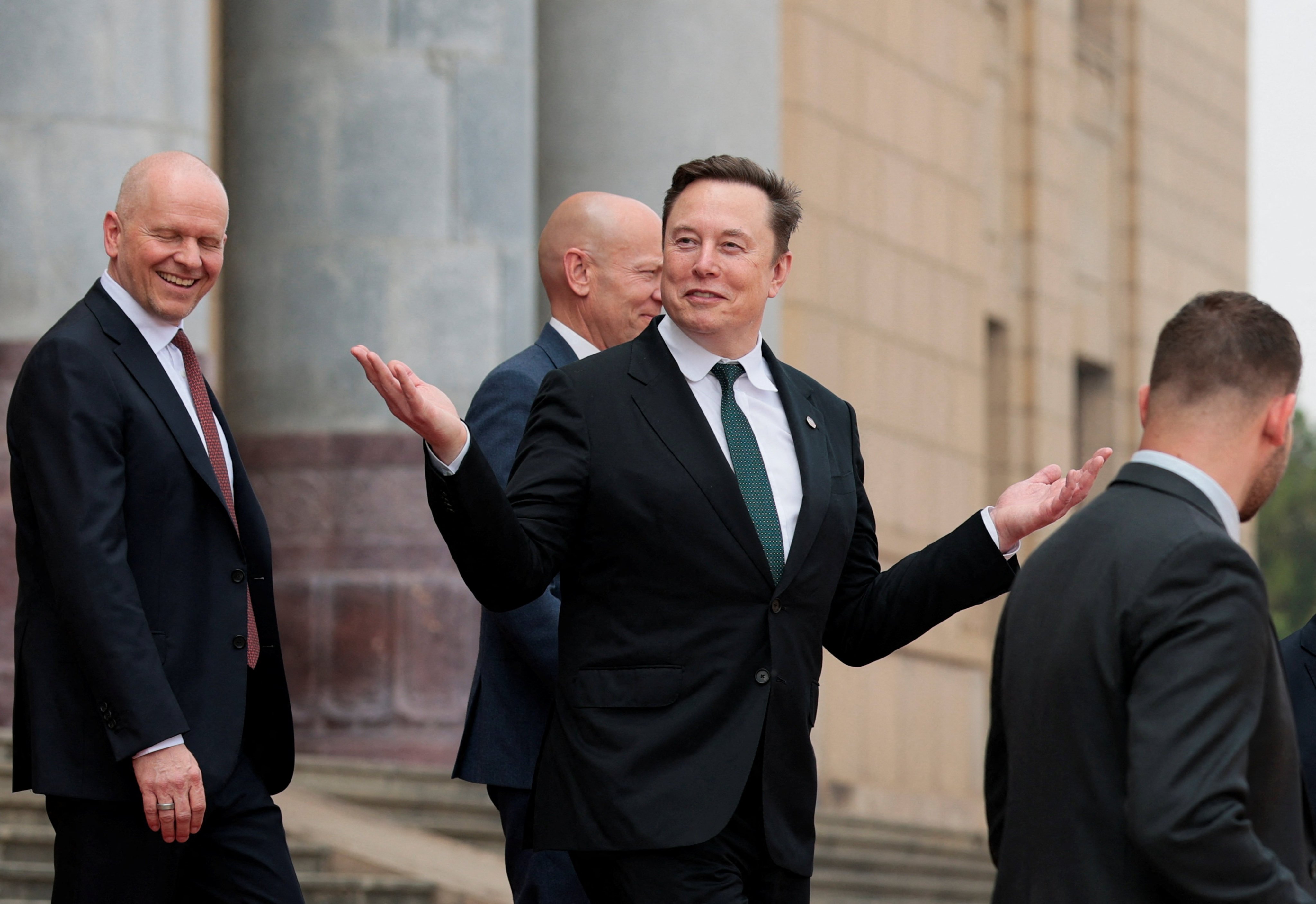 Billionaire Elon Musk gestures after attending a welcome ceremony for US President Donald Trump with President Xi Jinping at the Great Hall of the People in Beijing on Thursday. Photo: Reuters
