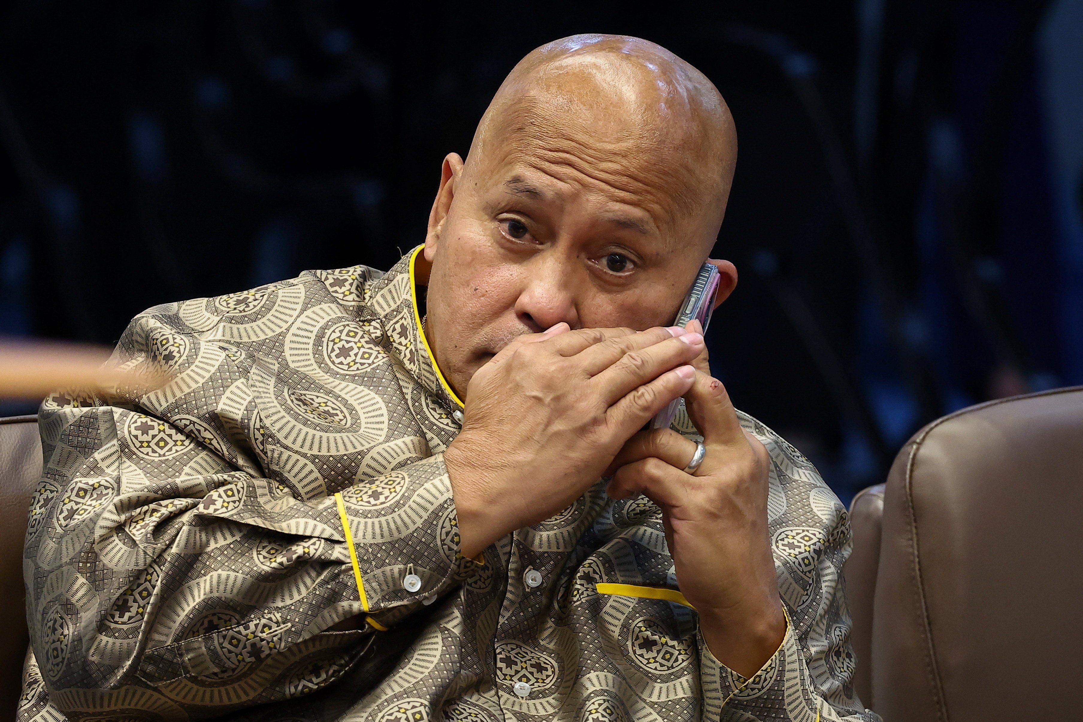 Philippine Senator Ronald “Bato” dela Rosa, the chief enforcer of former president Rodrigo Duterte’s drug war, takes a phone call during a session at the Senate on Wednesday. Photo: Reuters