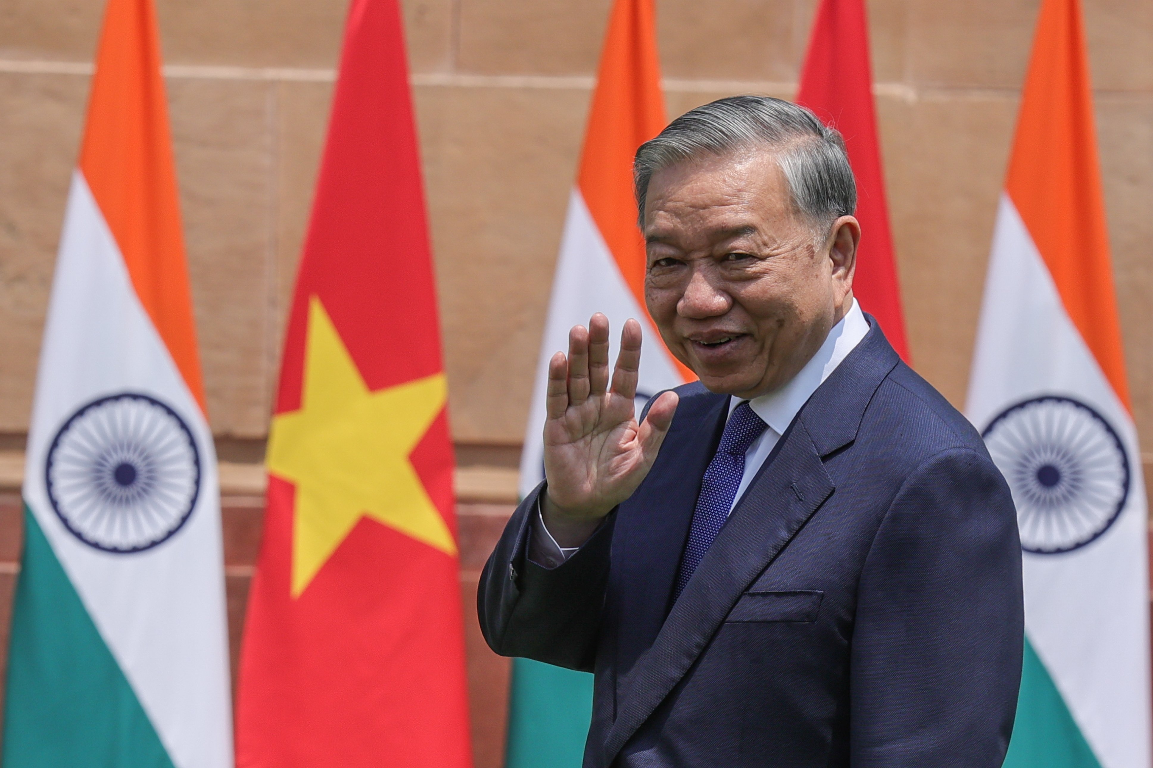 Vietnam’s To Lam waves after shaking hands with Indian Prime Minister Narendra Modi before their meeting at Hyderabad House in New Delhi on May 6. Photo: EPA