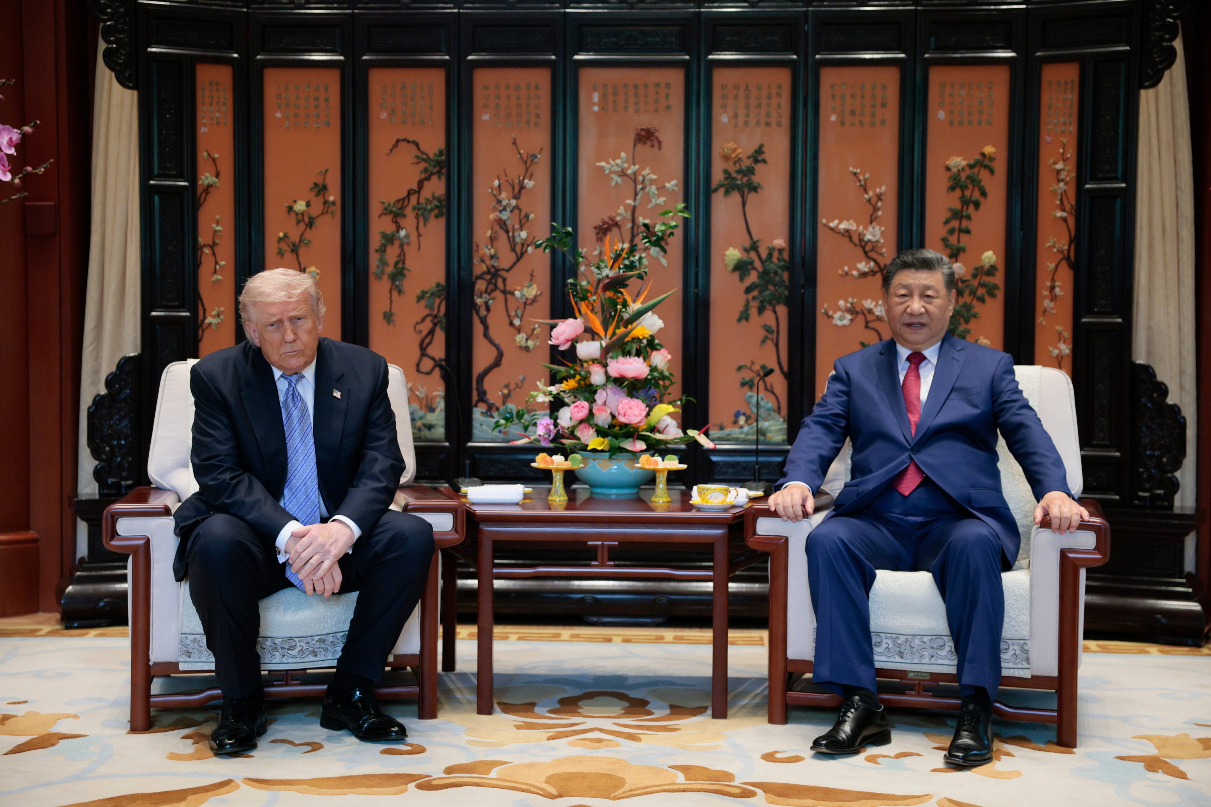 Presidents Xi Jinping and Donald Trump attend a meeting on the sidelines of their visit to the Zhongnanhai compound, in Beijing on Friday. Photo: Pool via AP