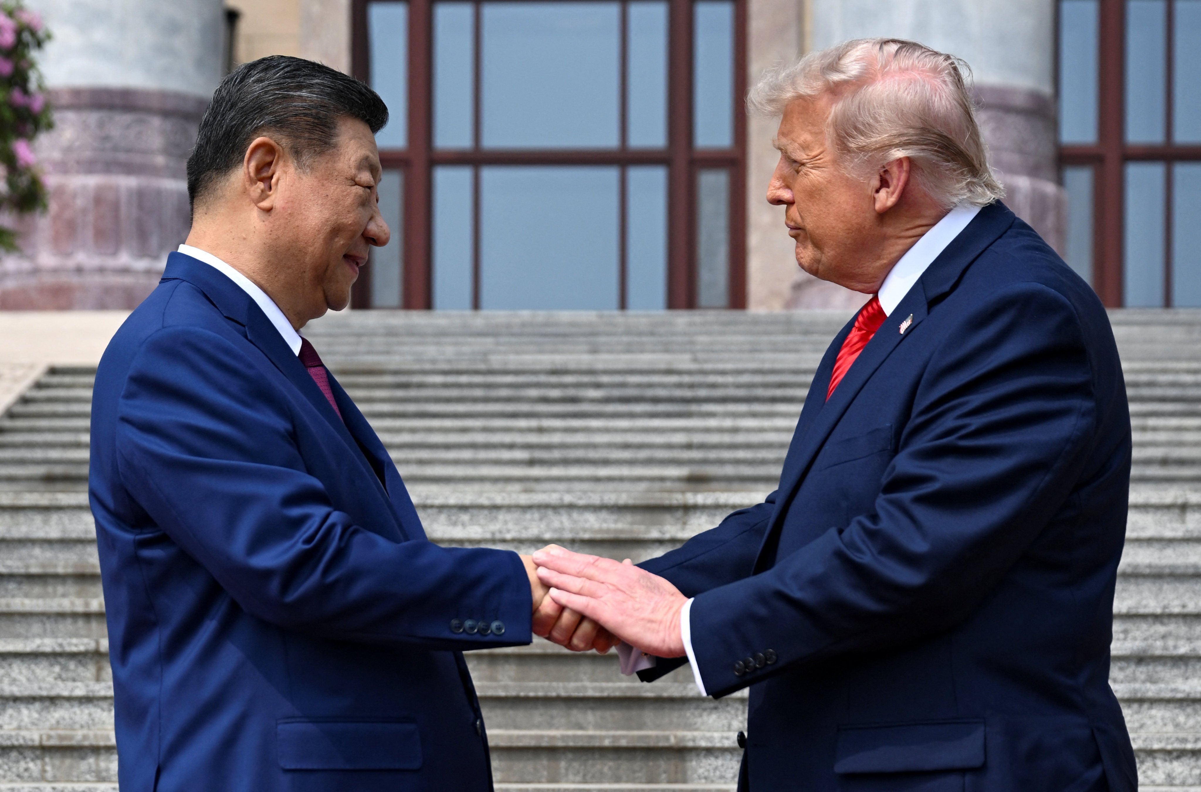 US President Donald Trump shakes hands with his Chinese counterpart Xi Jinping during his state visit to Beijing on May 14, 2026. Photo: Pool via Reuters