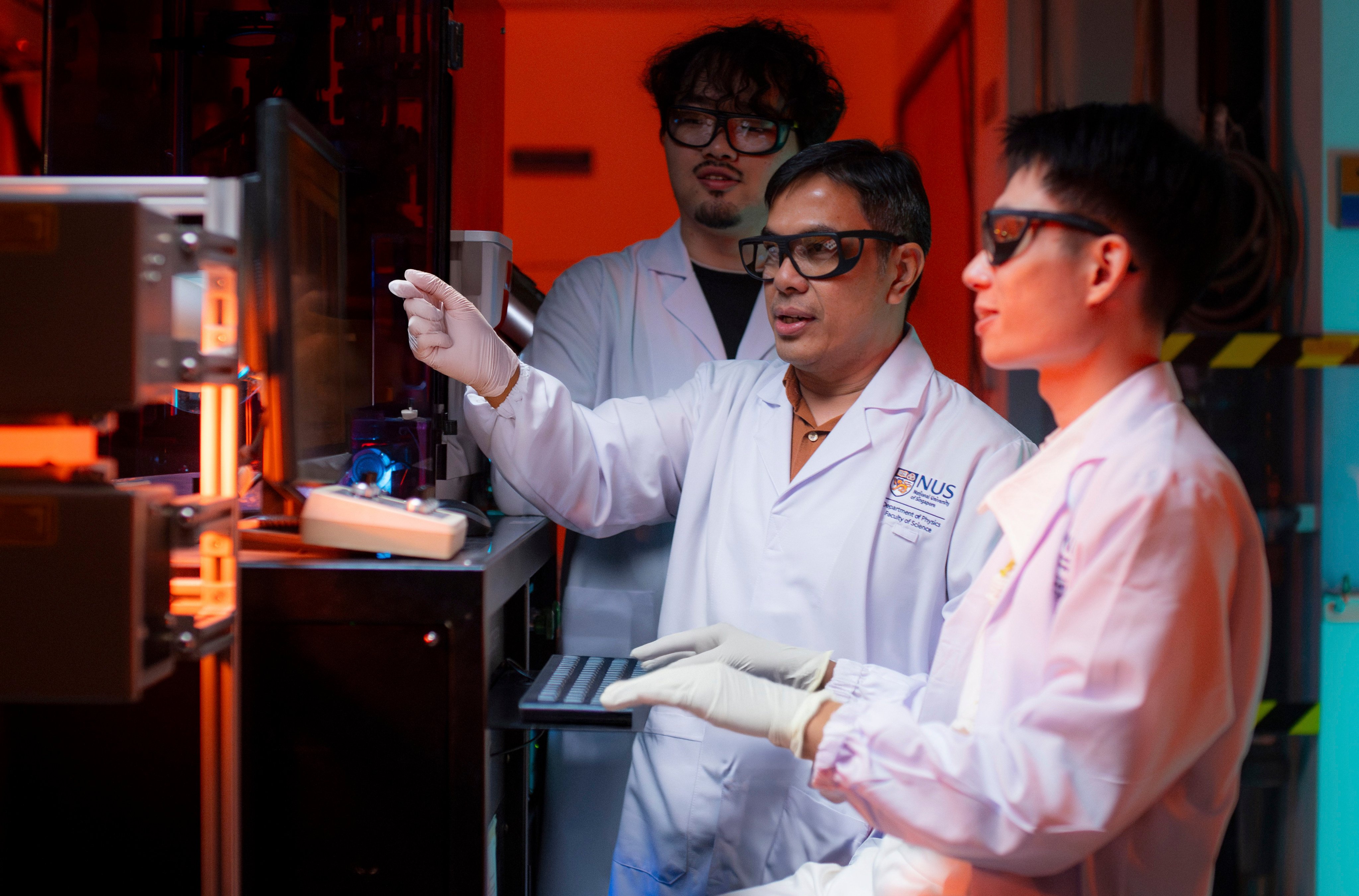 Stephen Lin Er Chow (right), pictured with colleagues from the research team that designed the new copper-free superconducting material. Photo: NUS Faculty of Science