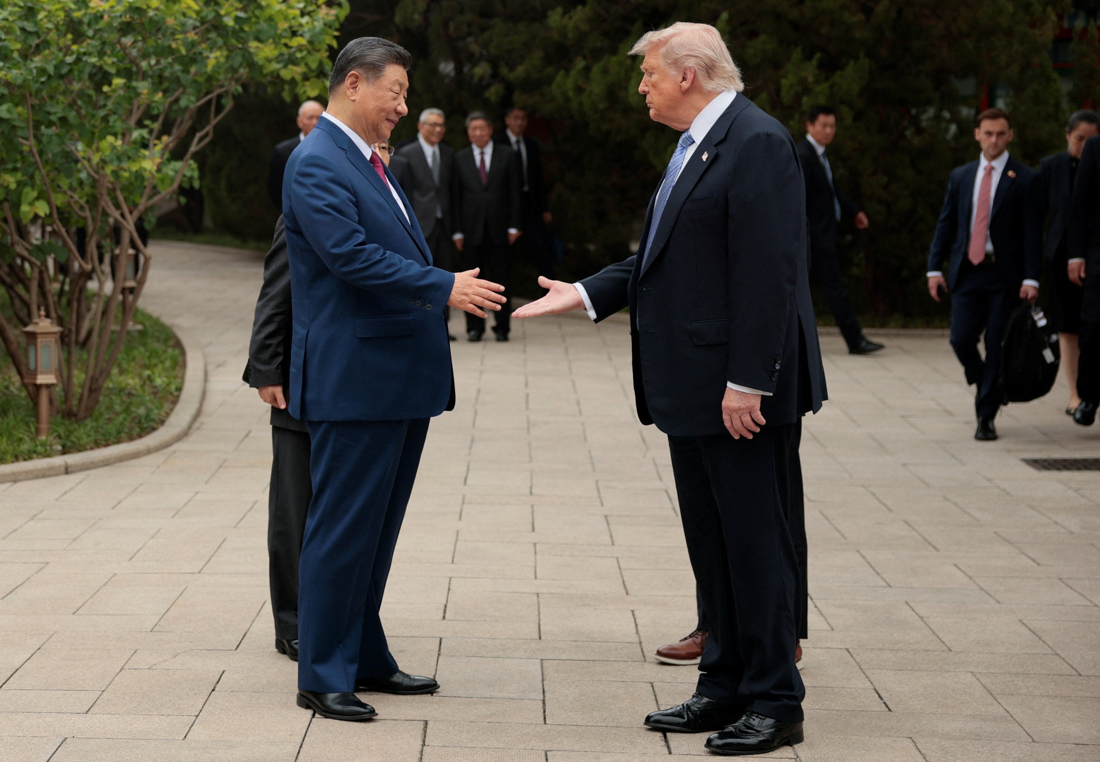 US President Donald Trump bids farewell to Chinese President Xi Jinping as he wraps up his state visit, in Beijing on Friday. Photo: Reuters