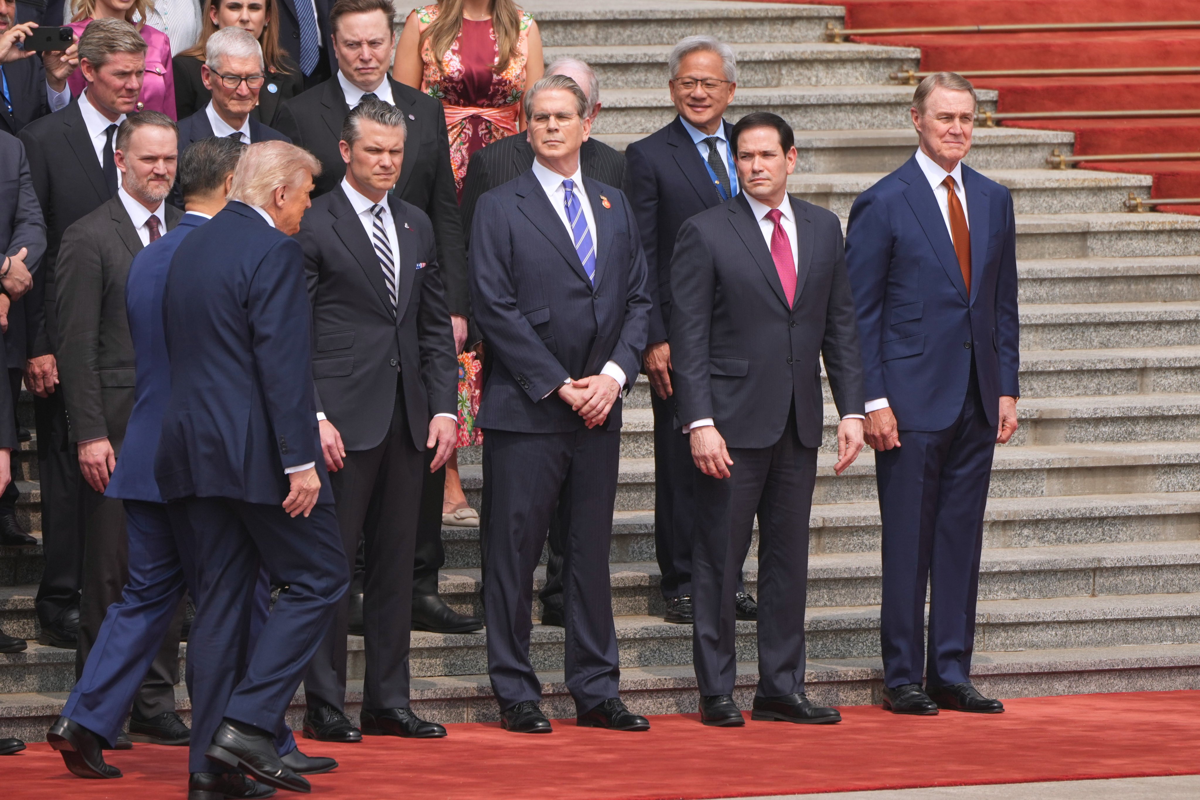 US tech bosses and officials attend a welcome ceremony at the Great Hall of the People in Beijing on May 14 as US President Donald Trump and Chinese President Xi Jinping arrive. Photo: AP