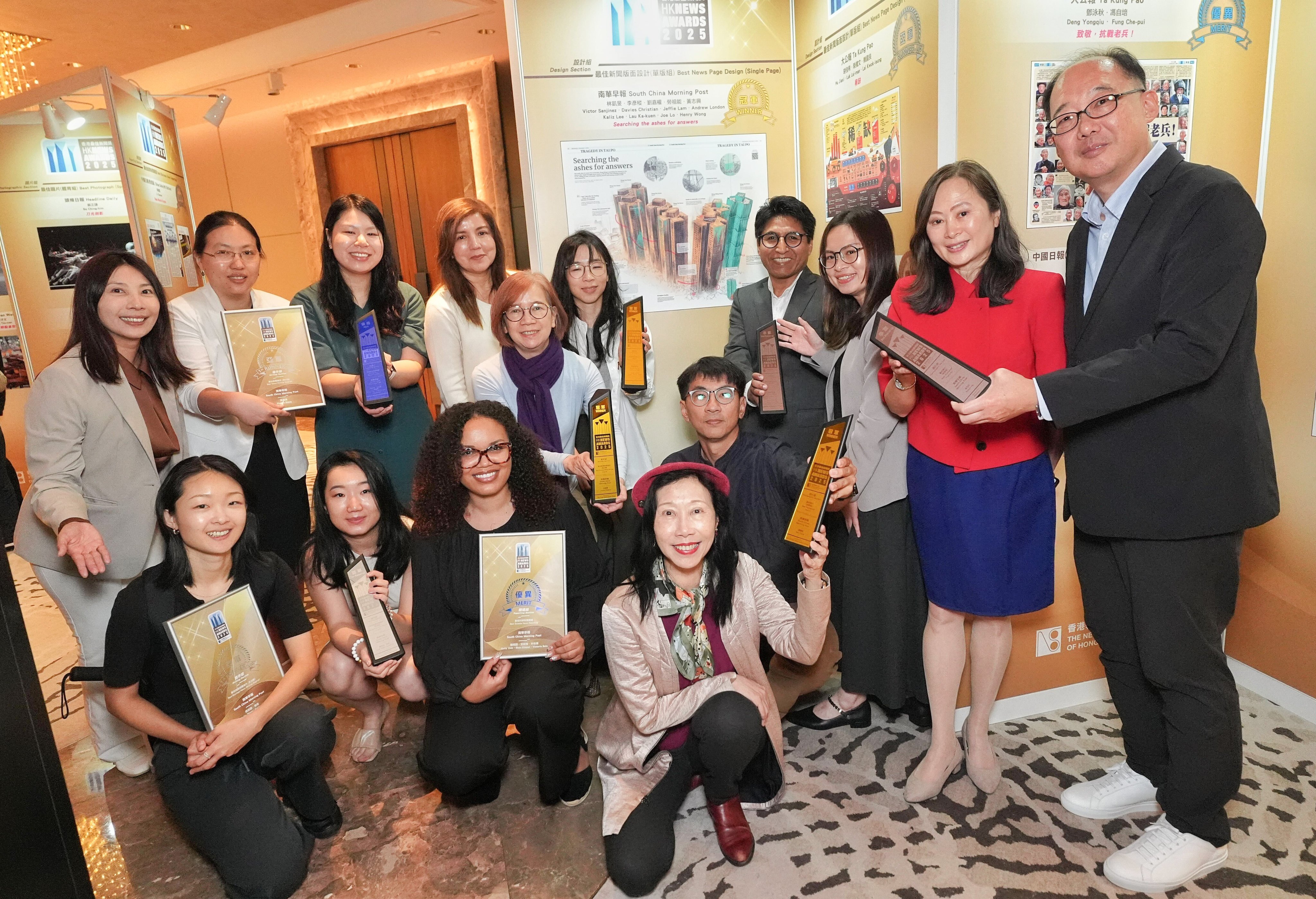 SCMP publisher Tammy Tam (second from right), executive editor Zuraidah Ibrahim (back row, fourth from left) and the publication’s award-winning journalists. Photo: Elson Li