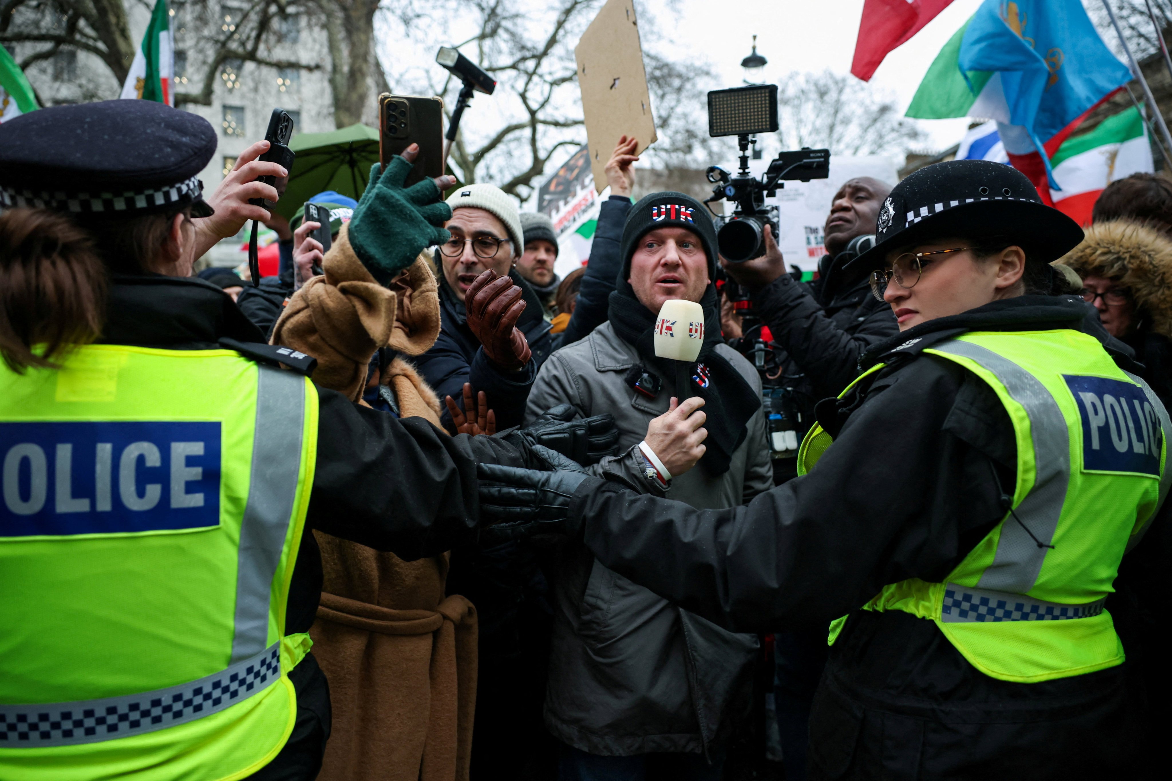 Far-right activist Stephen Yaxley-Lennon, known as Tommy Robinson, wears a ‘Unite The Kingdom’ (UTK) hat and scarf at a protest on January 11. Photo: Reuters