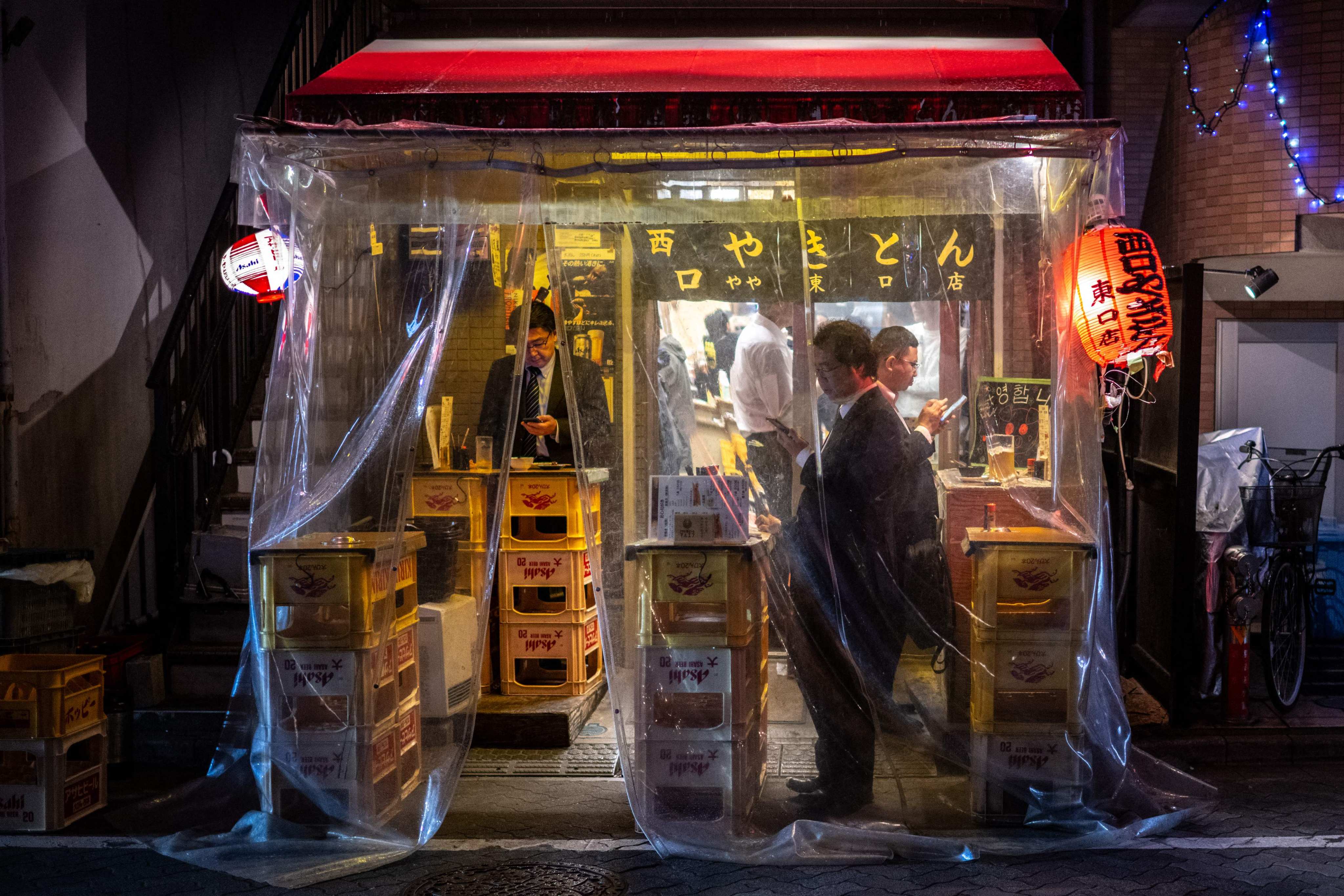 Diners visit a yakitori restaurant in Tokyo’s Asakusabashi district on April 15. Photo:AFP