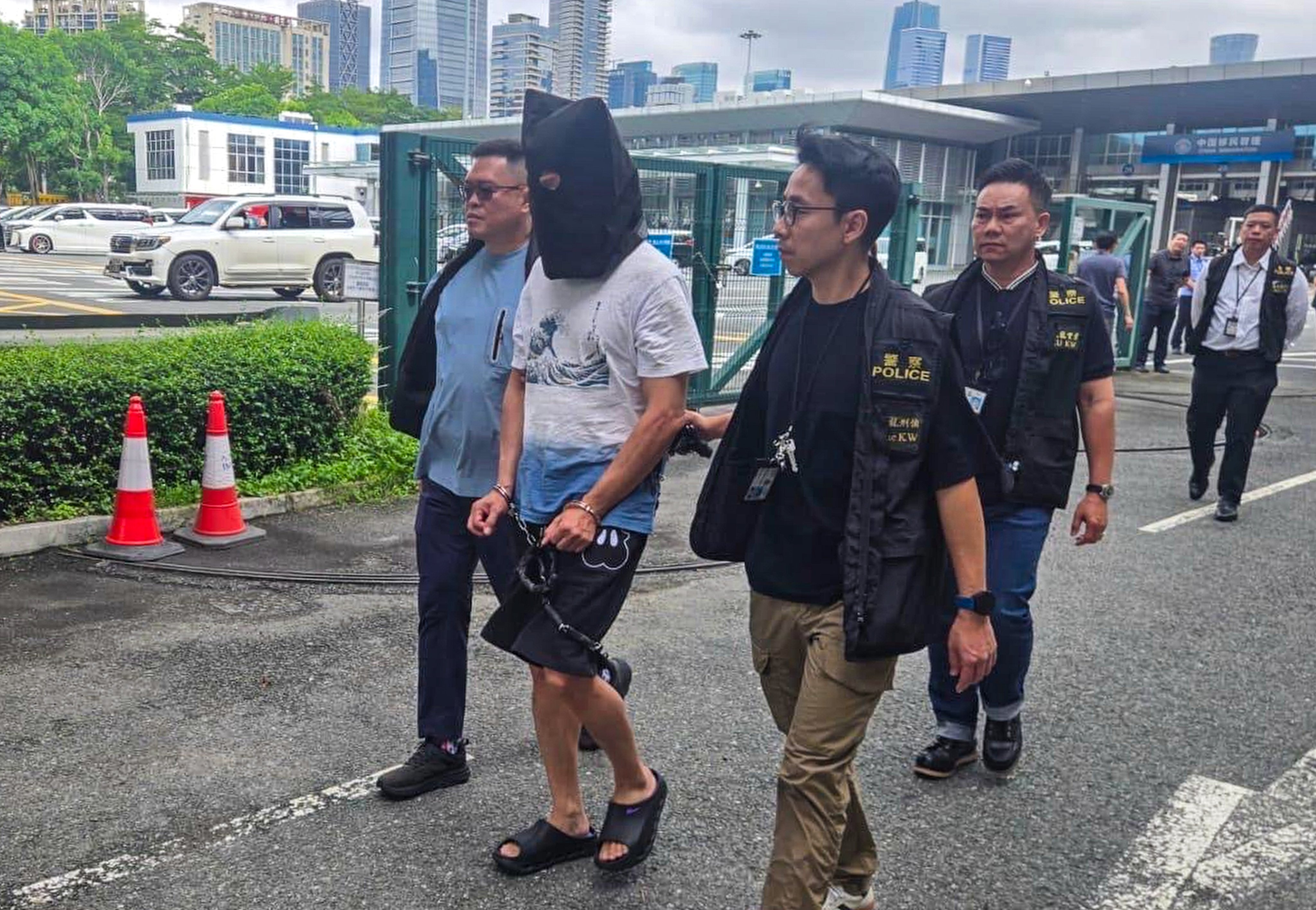 A suspect in the 1999 murder of a newspaper vendor is returned to Hong Kong on Saturday. Photo: Handout