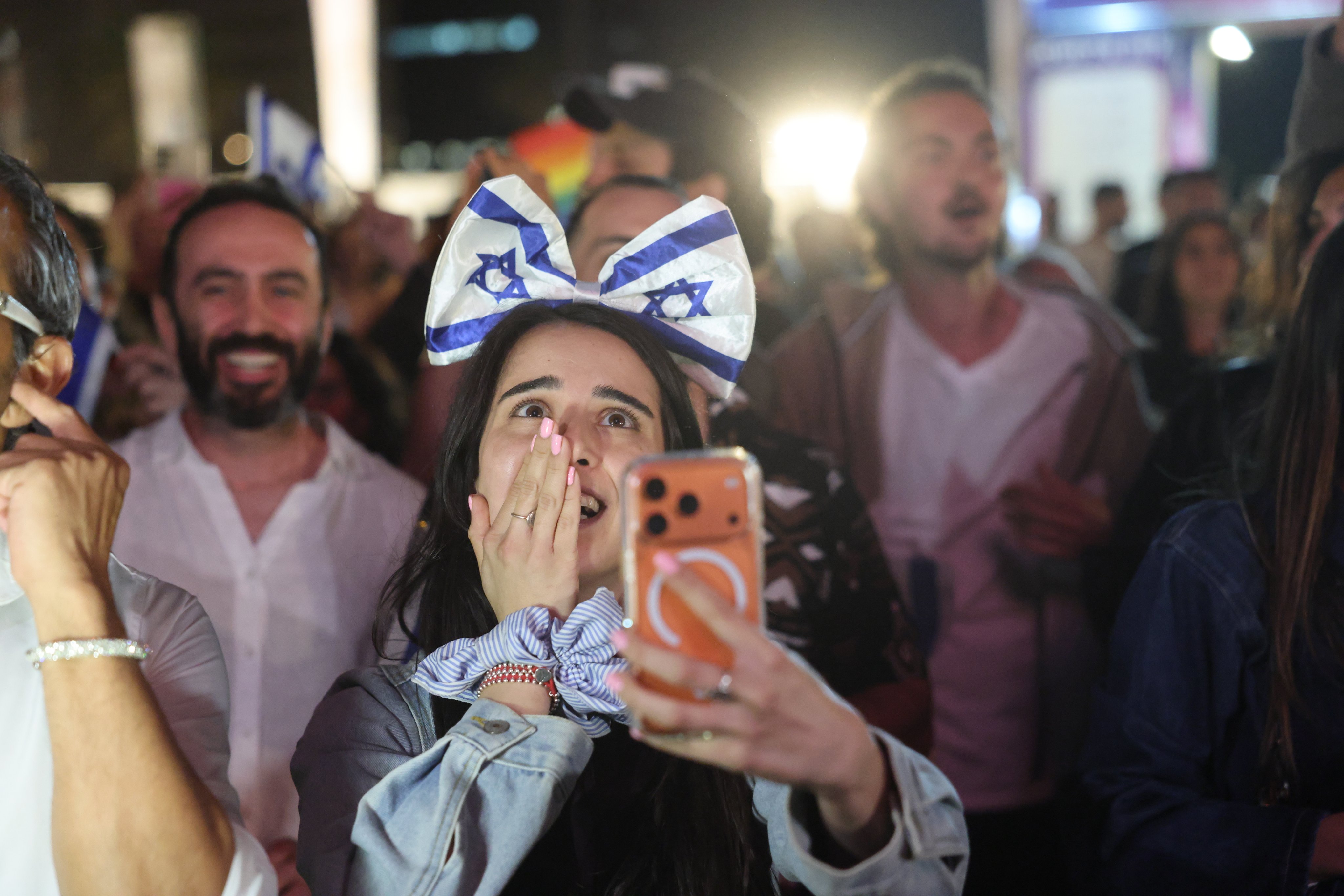People react at a live public viewing event to watch the Eurovision grand final in Tel Aviv, Israel. Photo: EPA