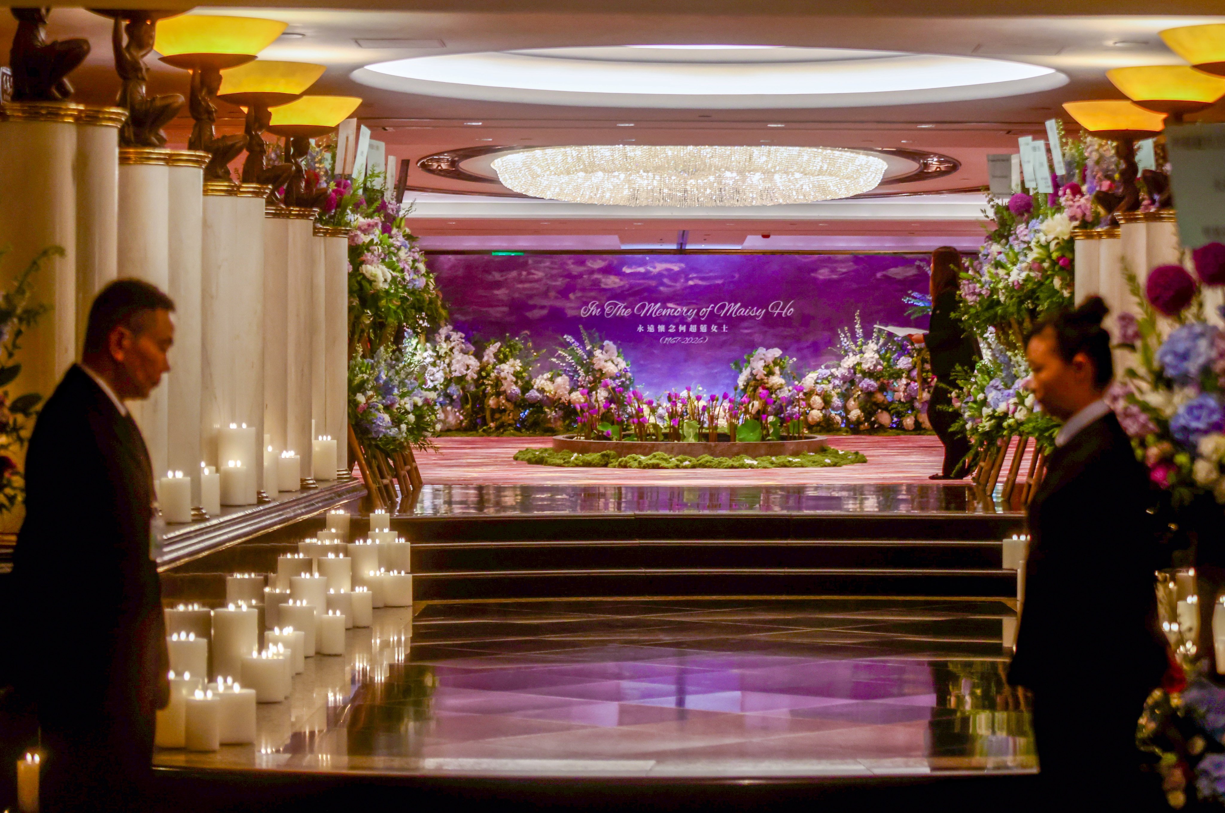 The hallway leading to the ballroom was lined with candles and flowers, with a floral pond set up in the lobby. Photo: Jonathan Wong