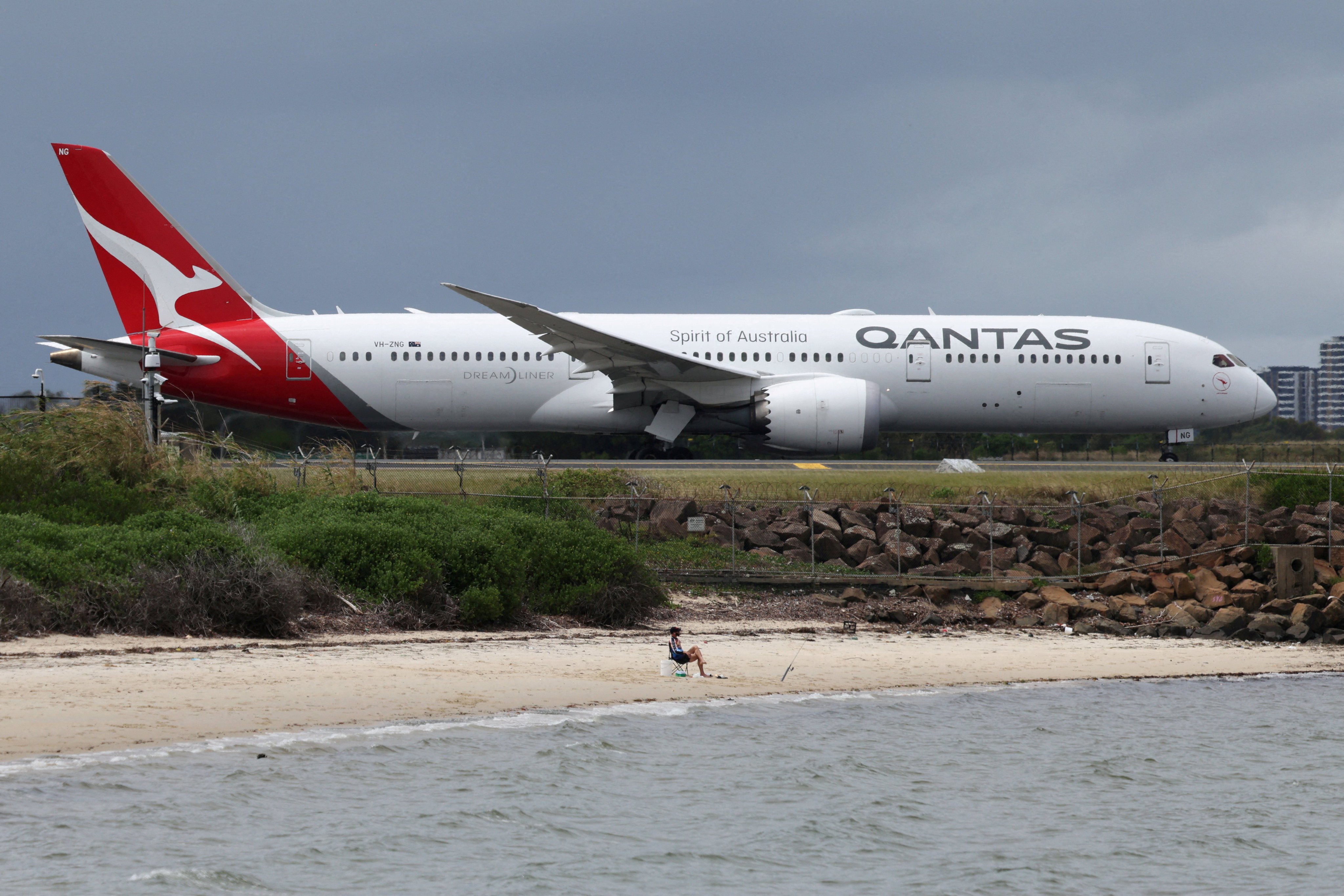 A Qantas plane taxis along a runway at Sydney Airport in February. Photo: Reuters