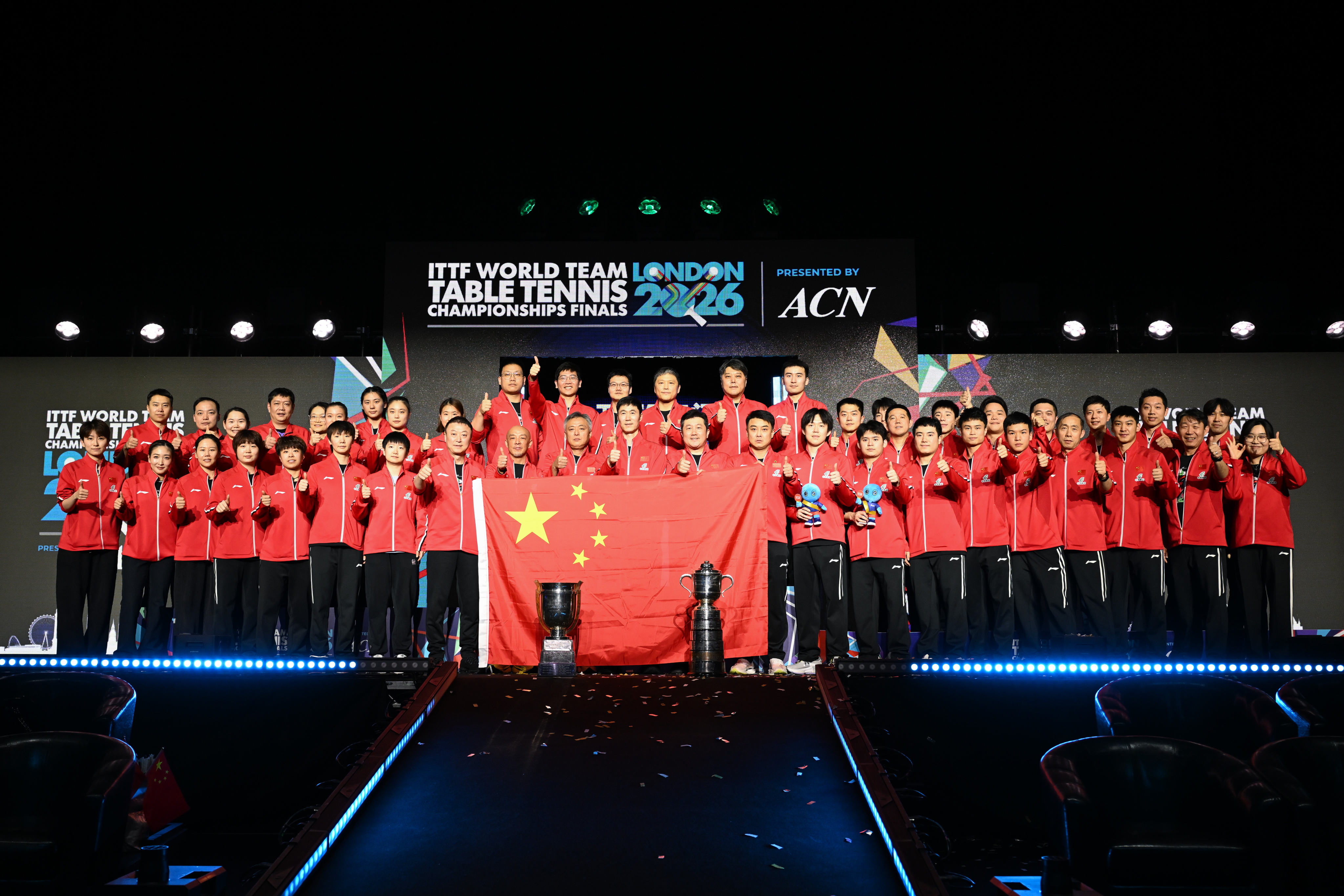 Members of the China men and women’s teams pose with their trophies after winning the ITTF World Team Table Tennis Championships. Photo: Xinhua