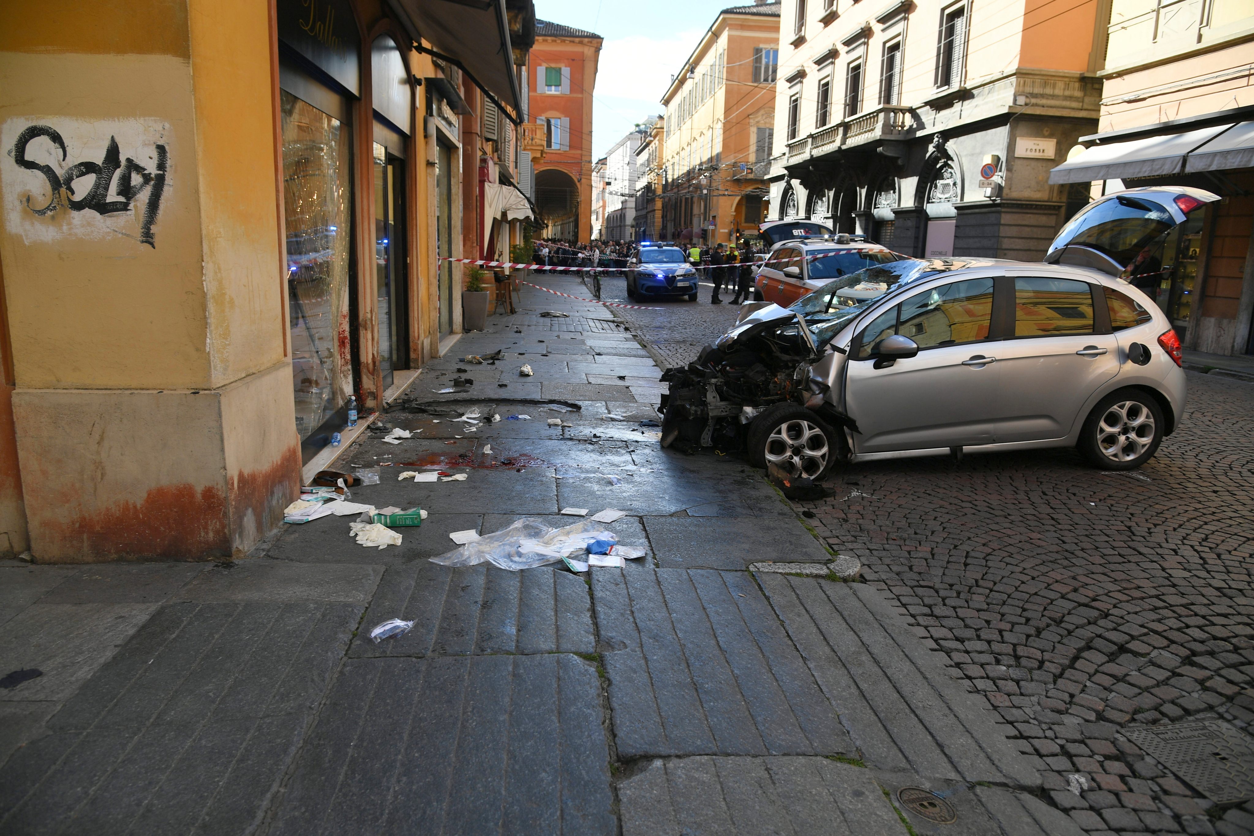A damaged car is seen after an incident in Modena, Italy, on Saturday. Photo: Lapresse via AP