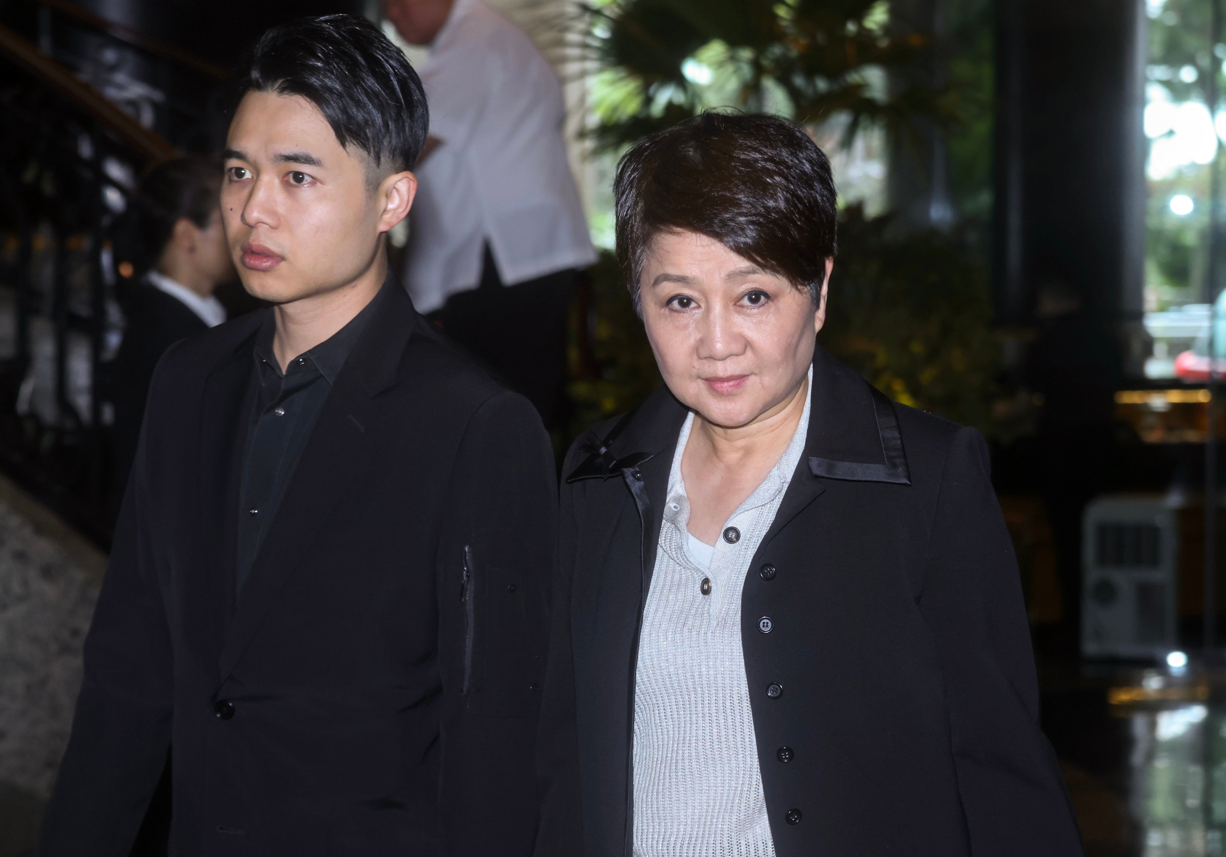 Angela Leong with her son Arnaldo Ho at the memorial service. Photo: Jonathan Wong