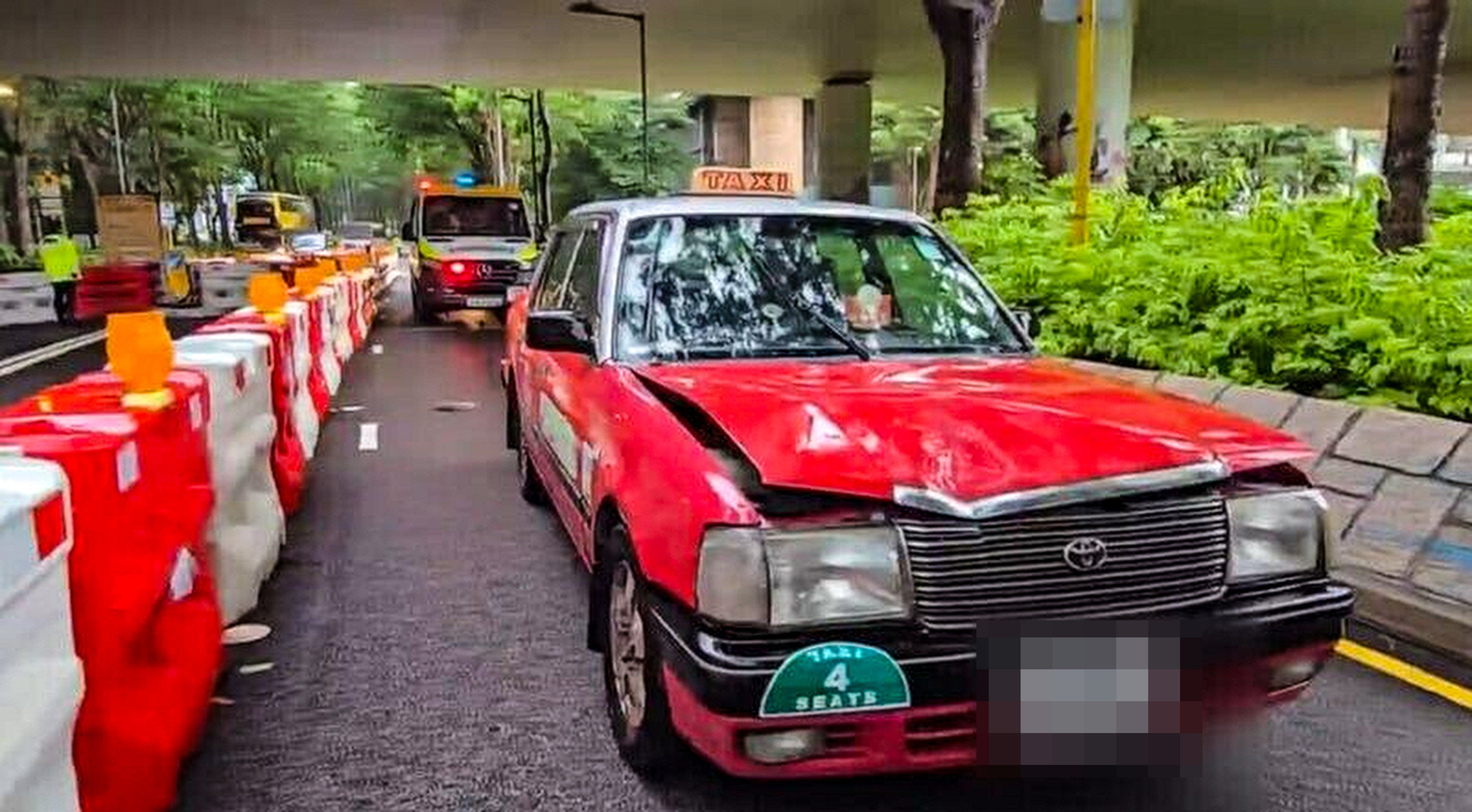 A man has died after being struck and trapped beneath a taxi in Tung Chung. Photo: Cable TV News