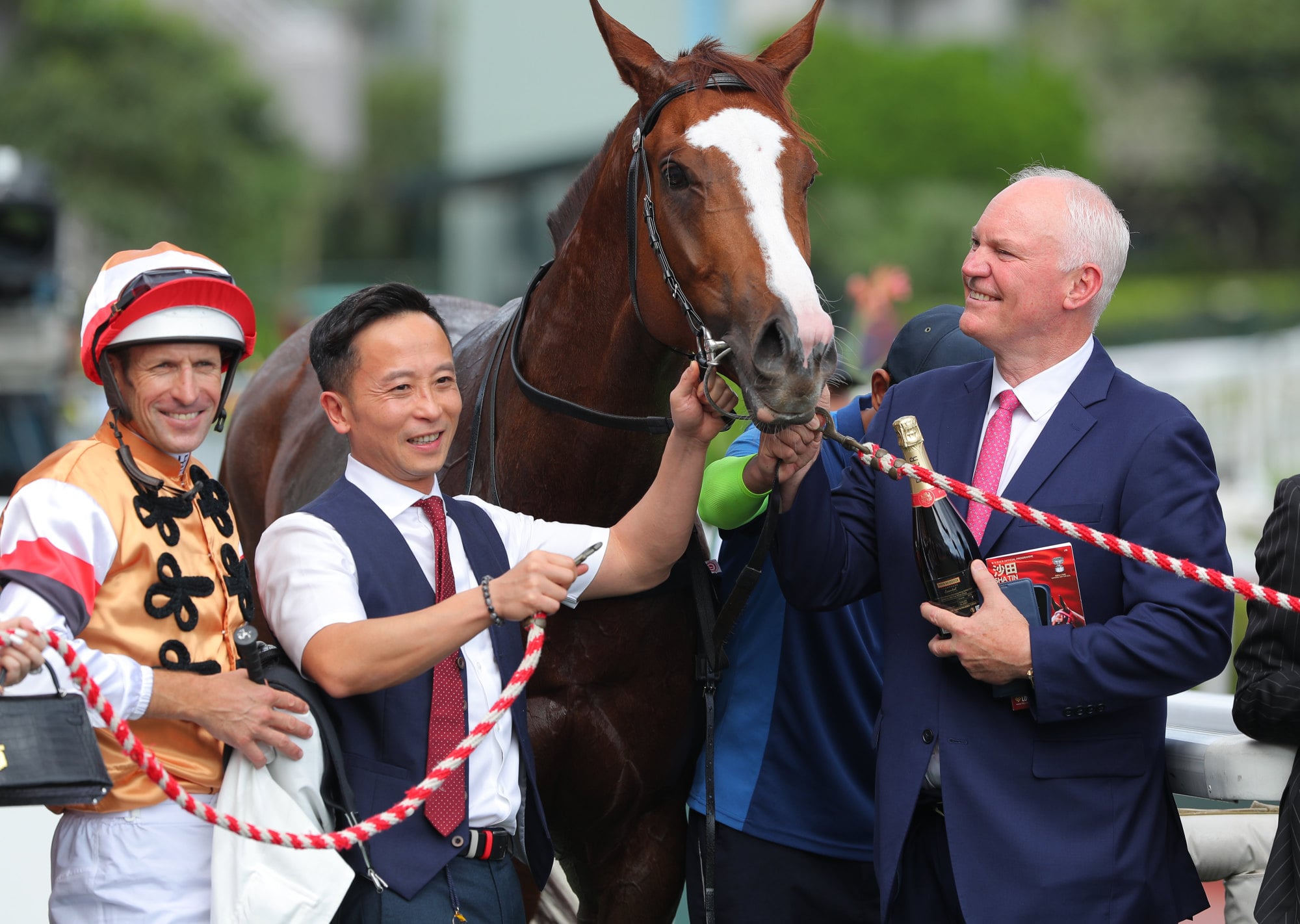 Connections celebrate the win of Geneva at Sha Tin. Connections celebrate the win of Geneva at Sha Tin.