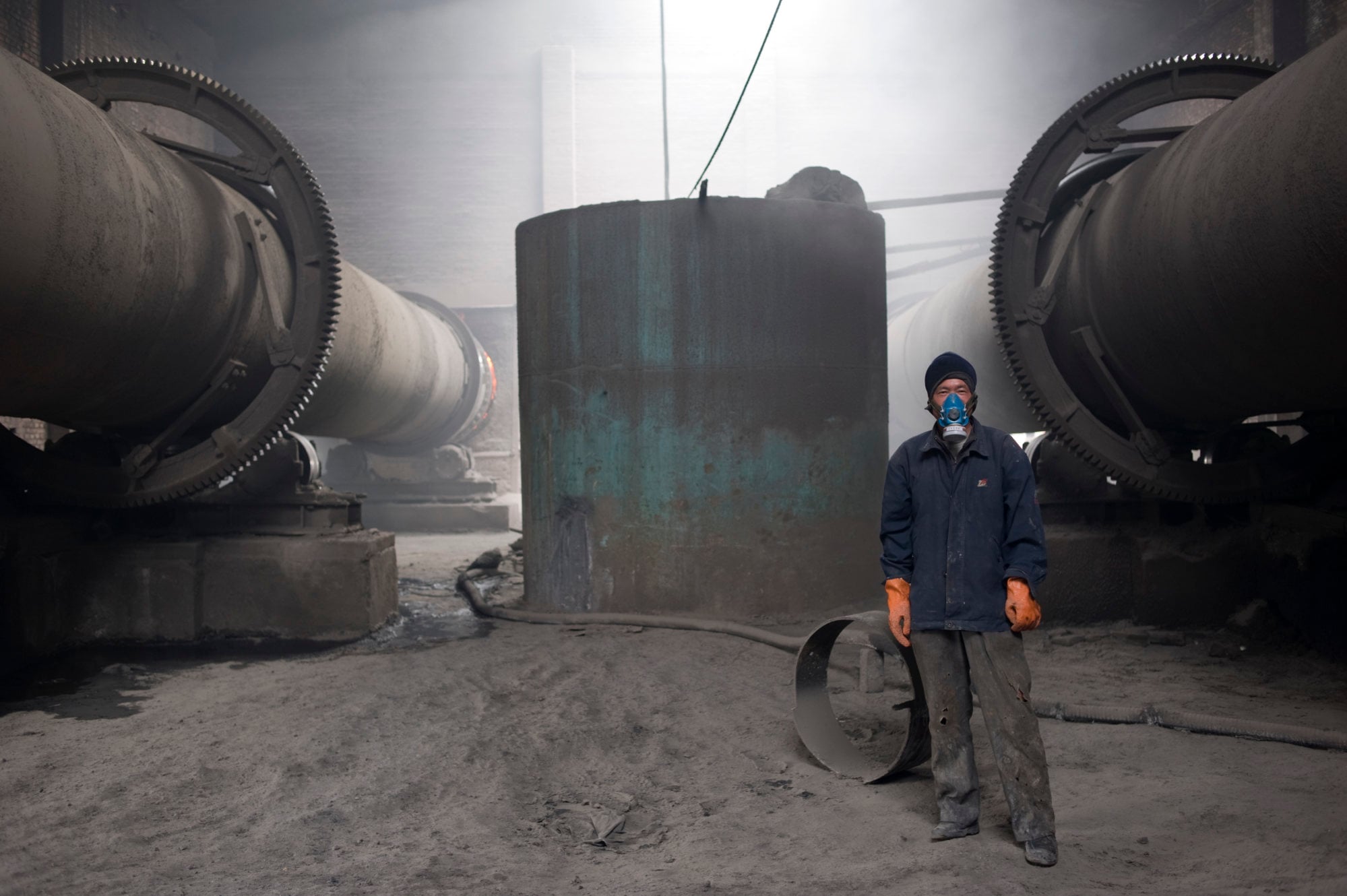 A worker poses at a rare earth processing plant not far from Bayan Obo. Photo: Sinopix