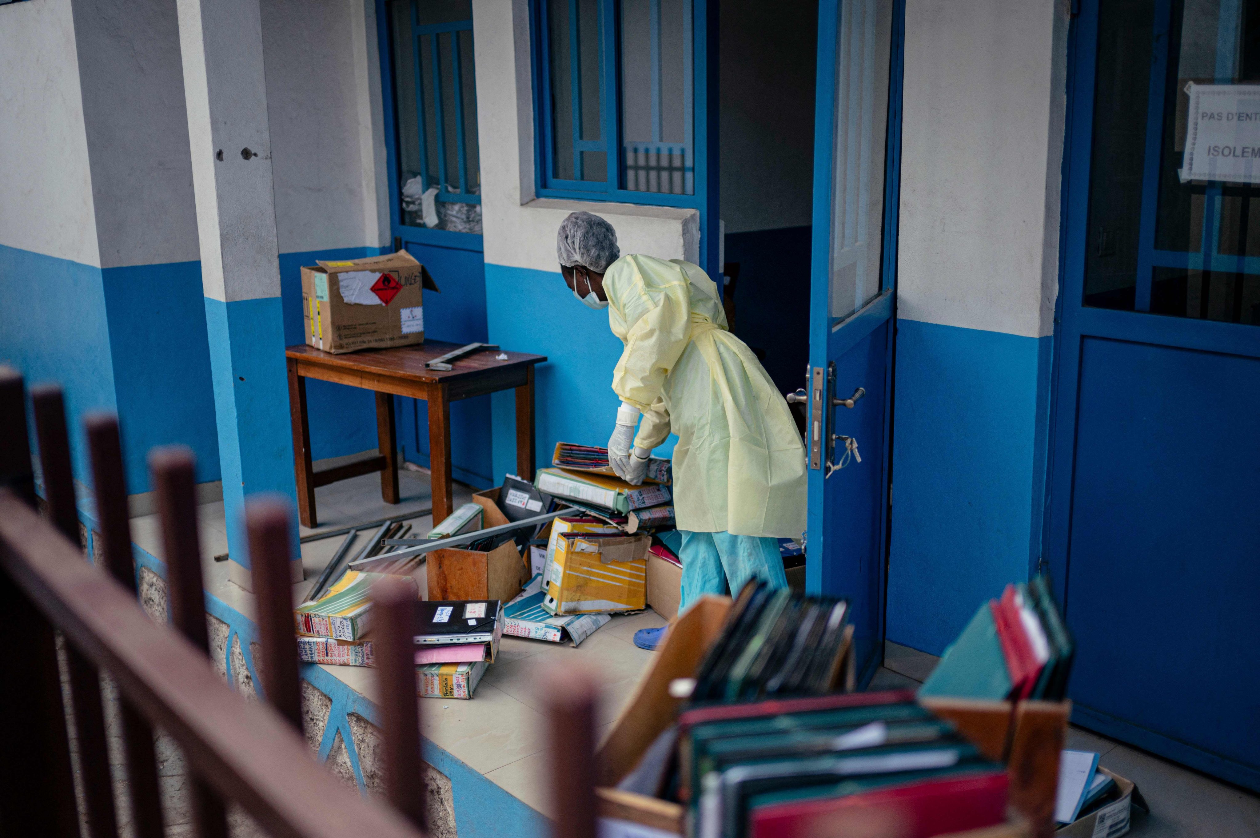 A staff member at CBCA Virunga Hospital in Goma, Democratic Republic of Congo, prepares rooms intended for possible suspected Ebola cases. Photo: AFP