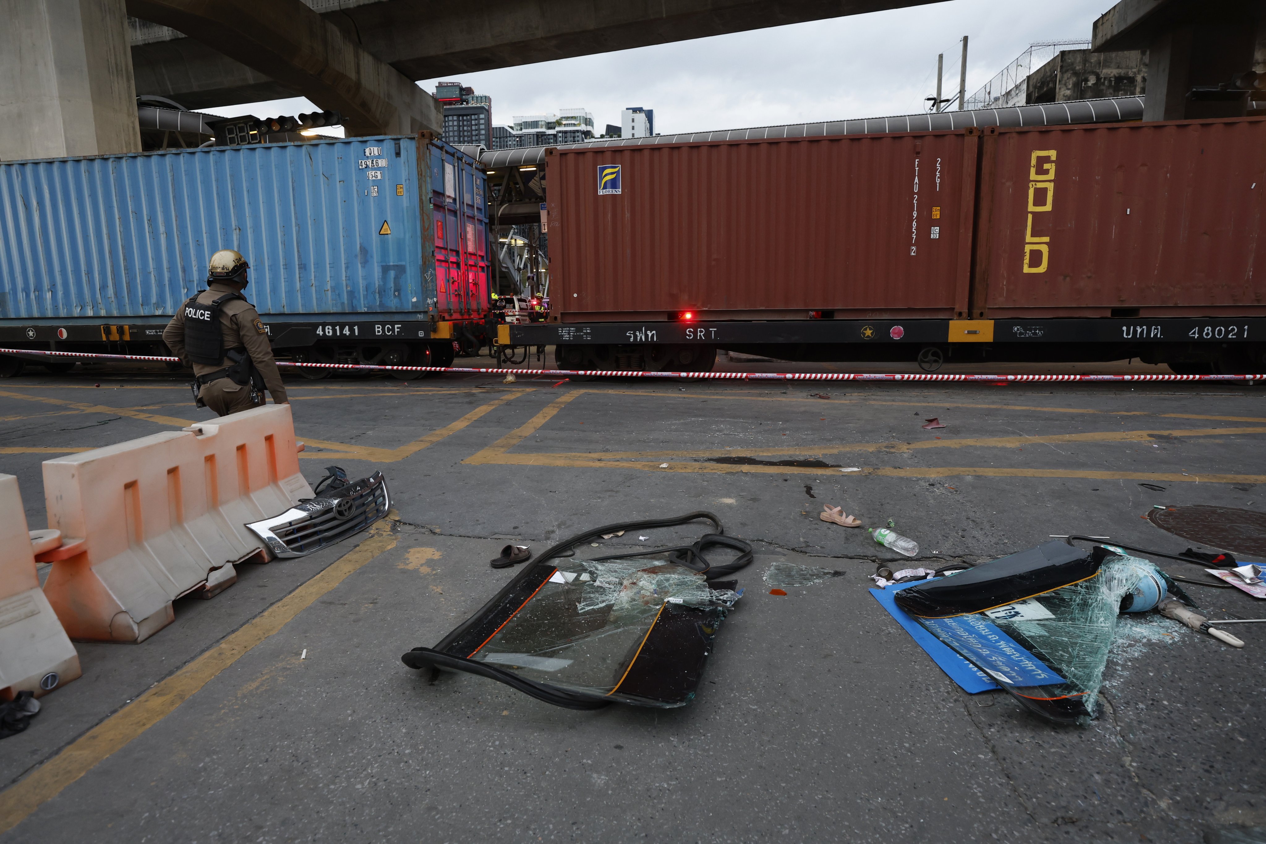 Debris at the accident site following Saturday’s collision between a goods train and a bus in Bangkok. Photo: EPA
