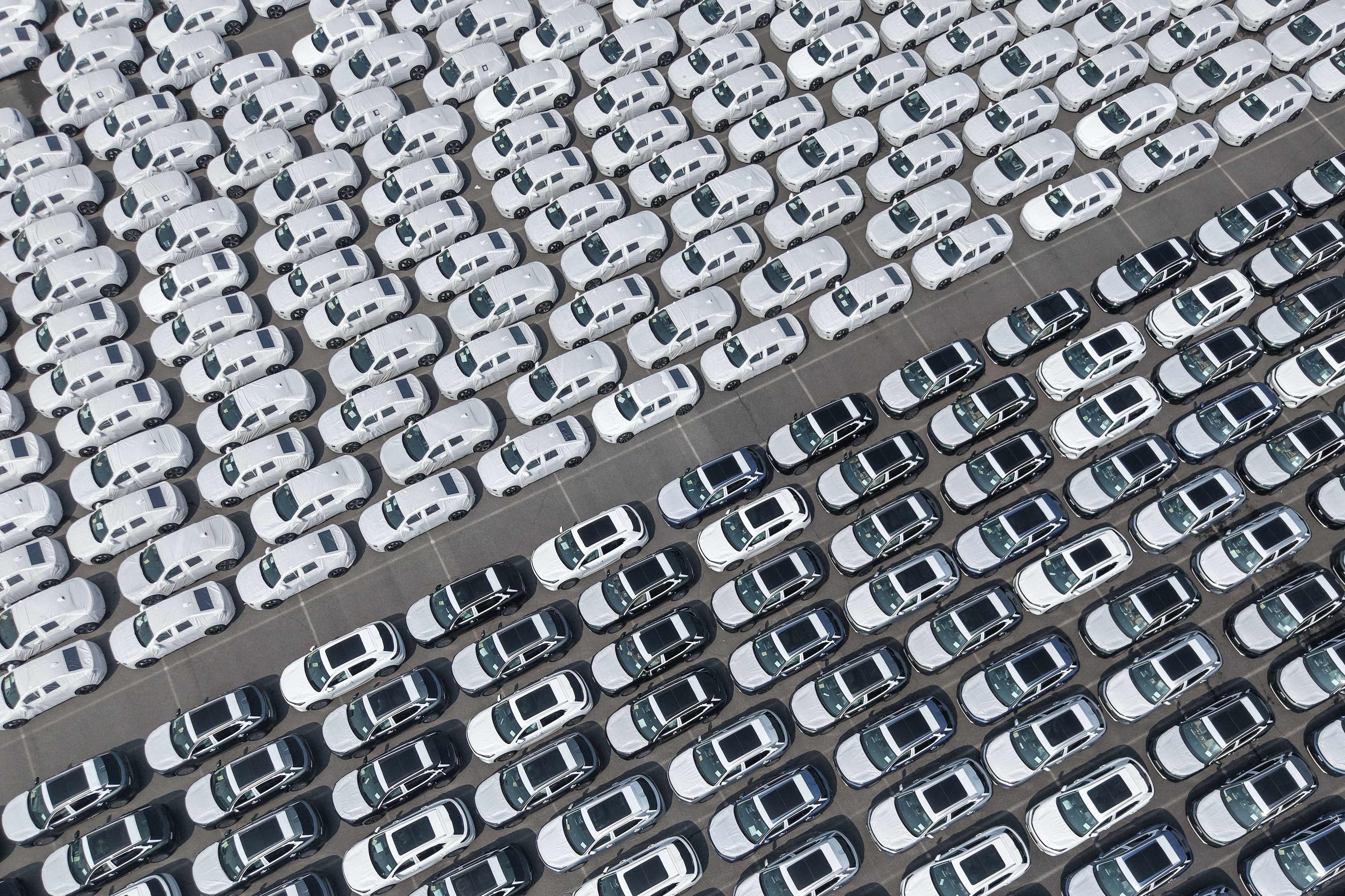 New electric vehicles are set to be loaded at Shanghai Port on May 9. Photo: AFP