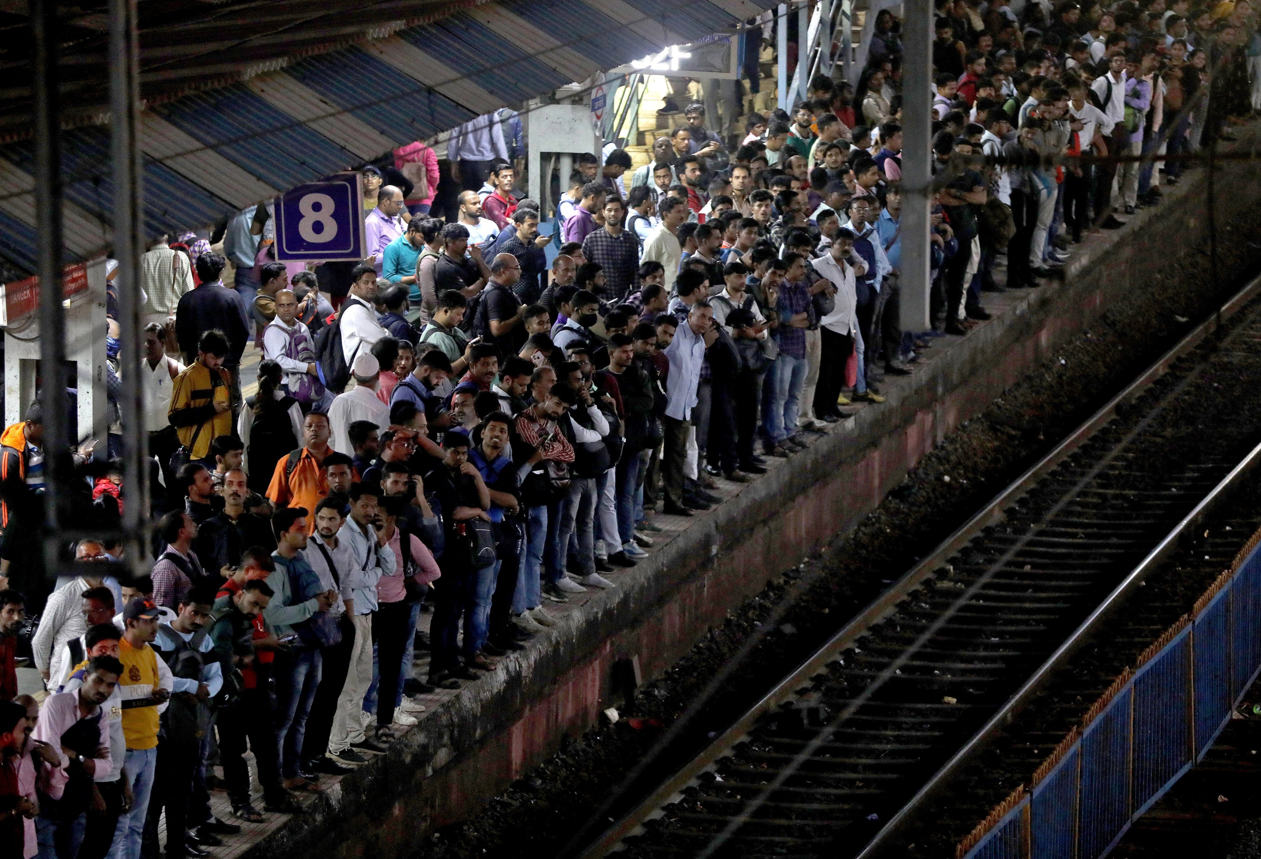 Commuters crowd on a train platform in Mumbai. The UN projects India’s population will keep rising for ‌about four decades, peaking at around 1.7 billion. Photo: Reuters