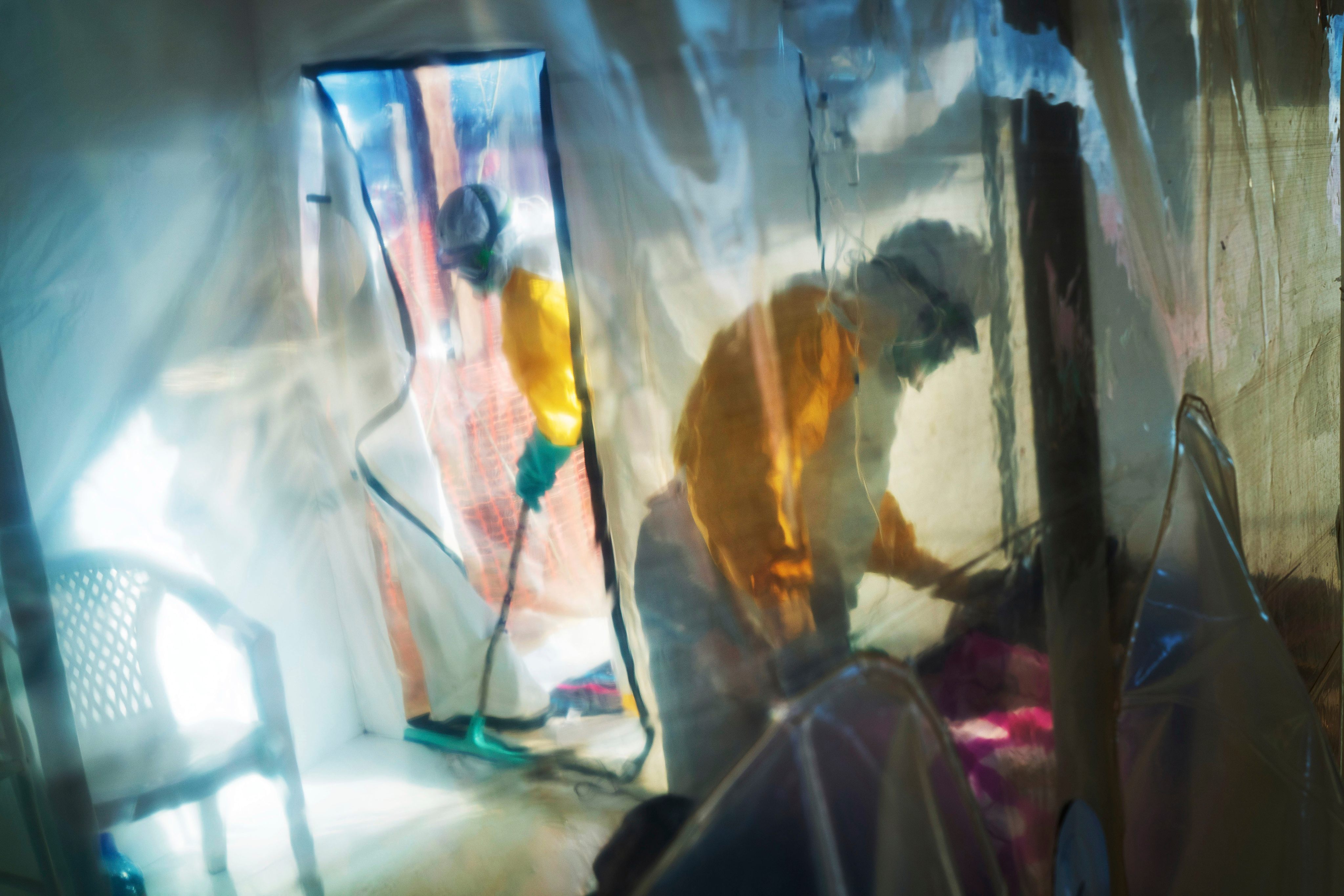Health workers in protective suits tend to an Ebola victim in an isolation tent in 2019. Photo: AP