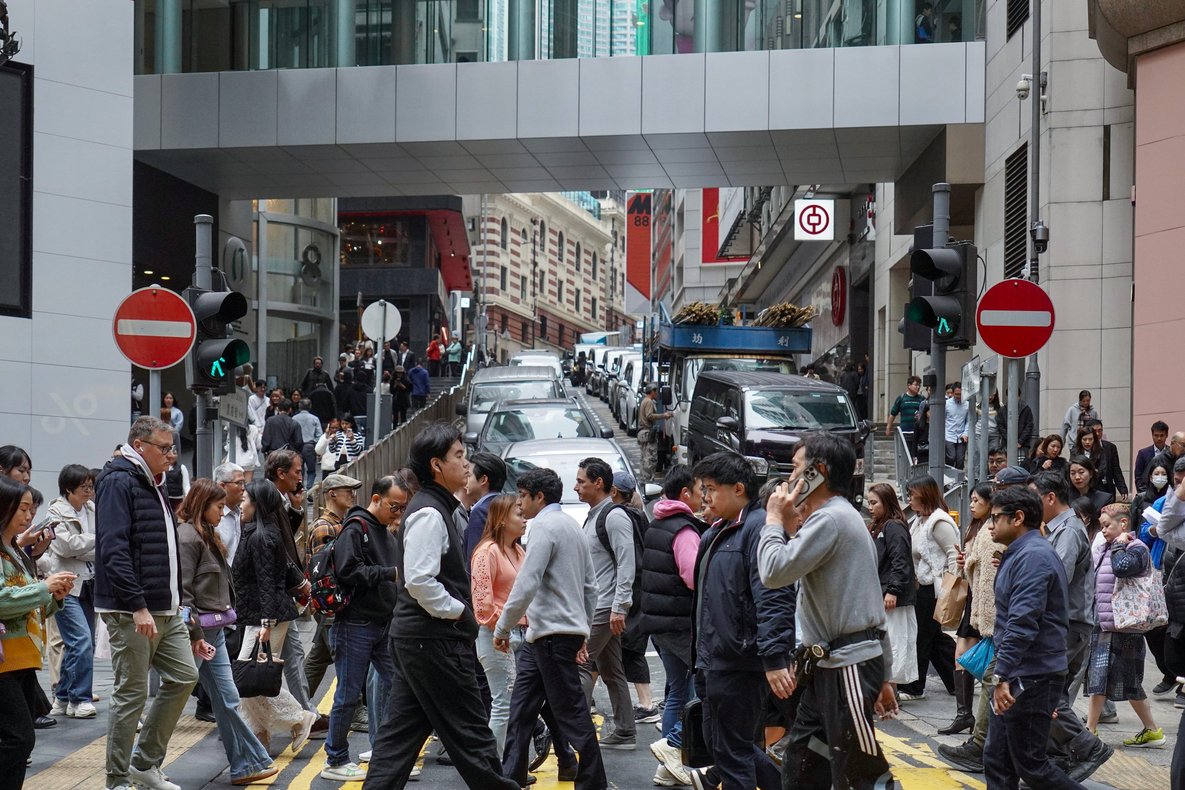 People walk on the streets of Hong Kong’s Central district during lunch hour on January 30. Photo: Karma Lo