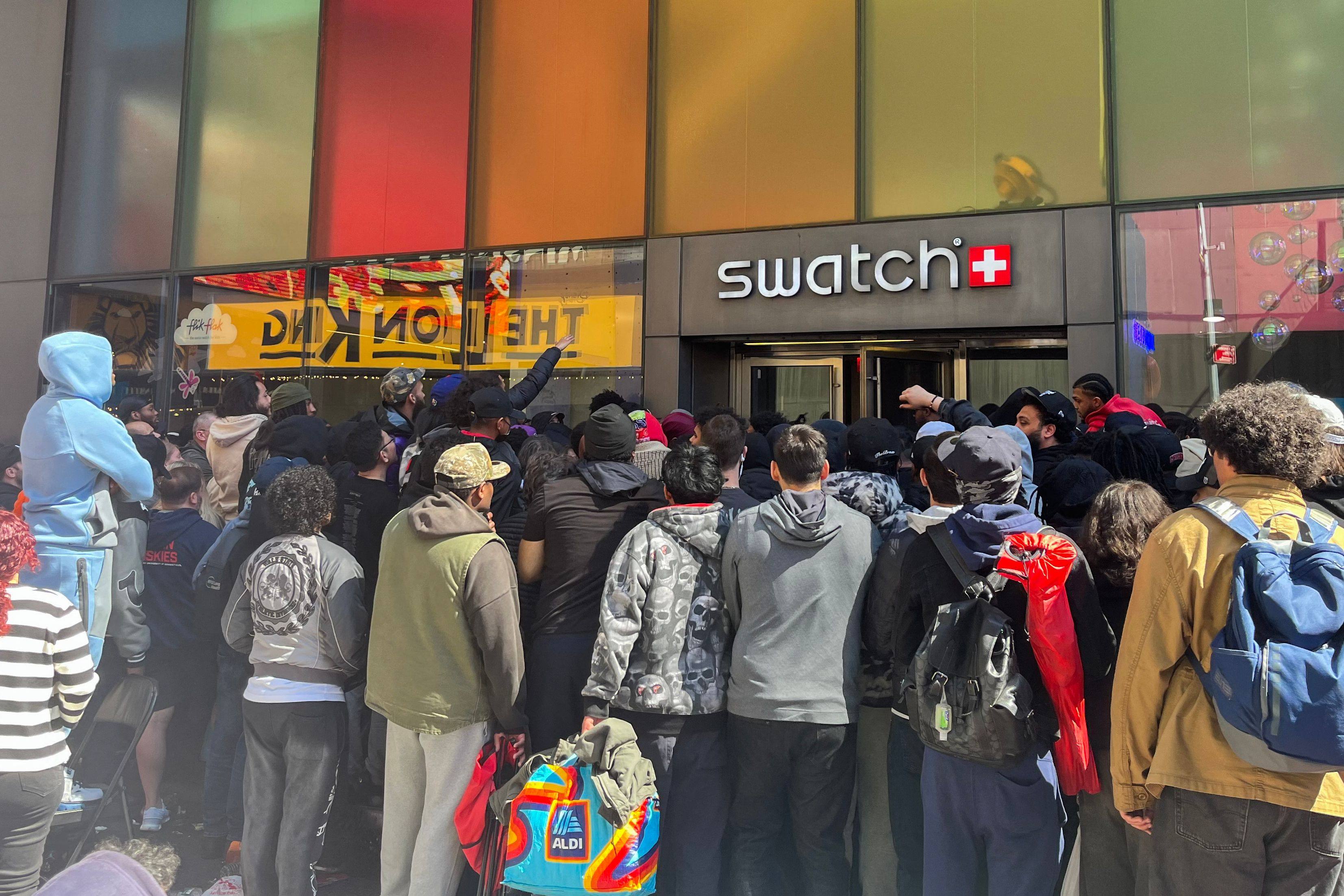 People wait in line to enter the Swatch store in Times Square, New York, on May 16, 2026, ahead of the Audemars Piguet x Swatch Royal Pop watch release. Photo: AFP